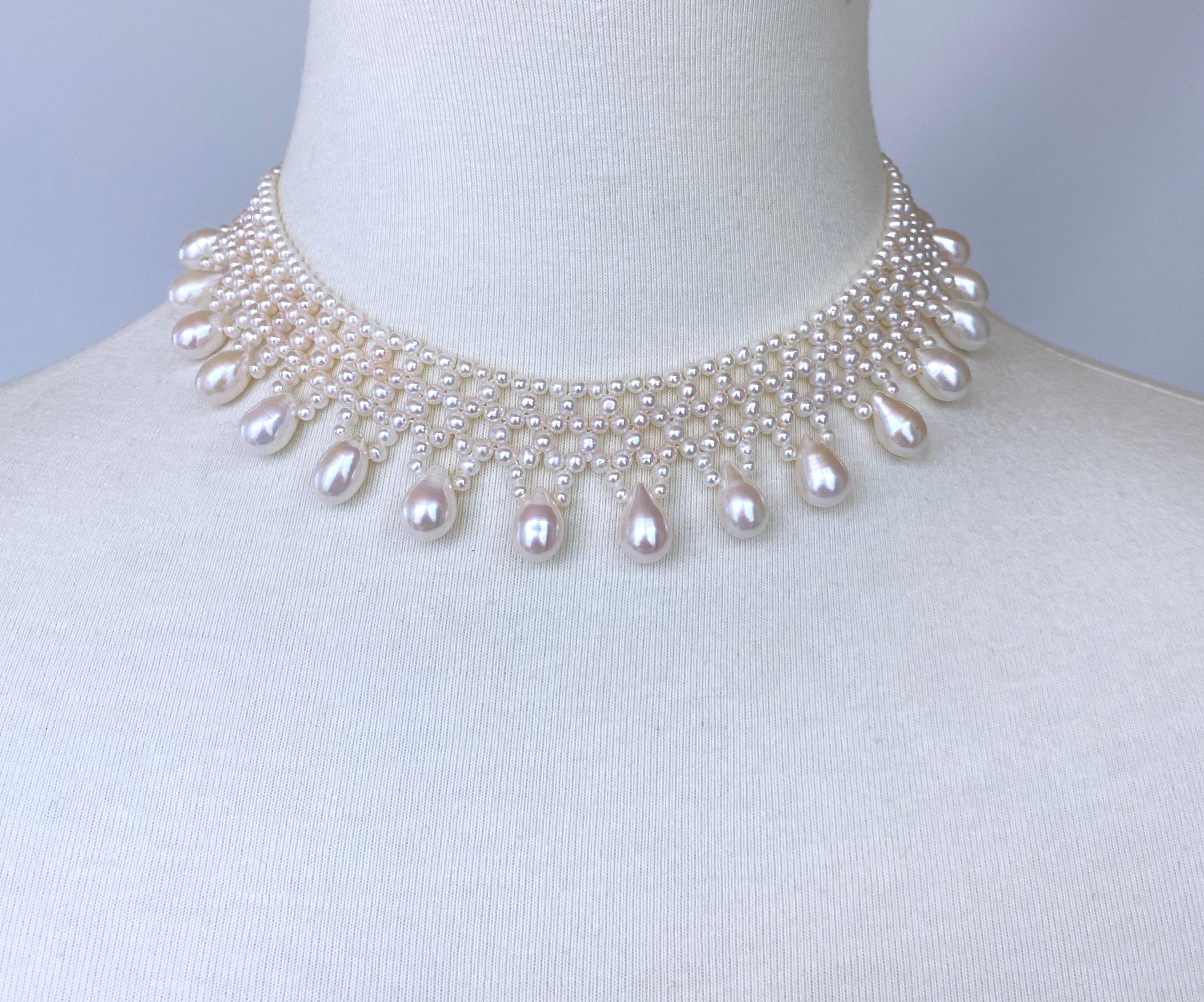 Beautiful piece by Marina J.
This lovely necklace is made using Cultured white Pearls which display an amazing luster, all intricately woven together into a fine lace like design. This piece has been woven with the slightest of Graduation, allowing