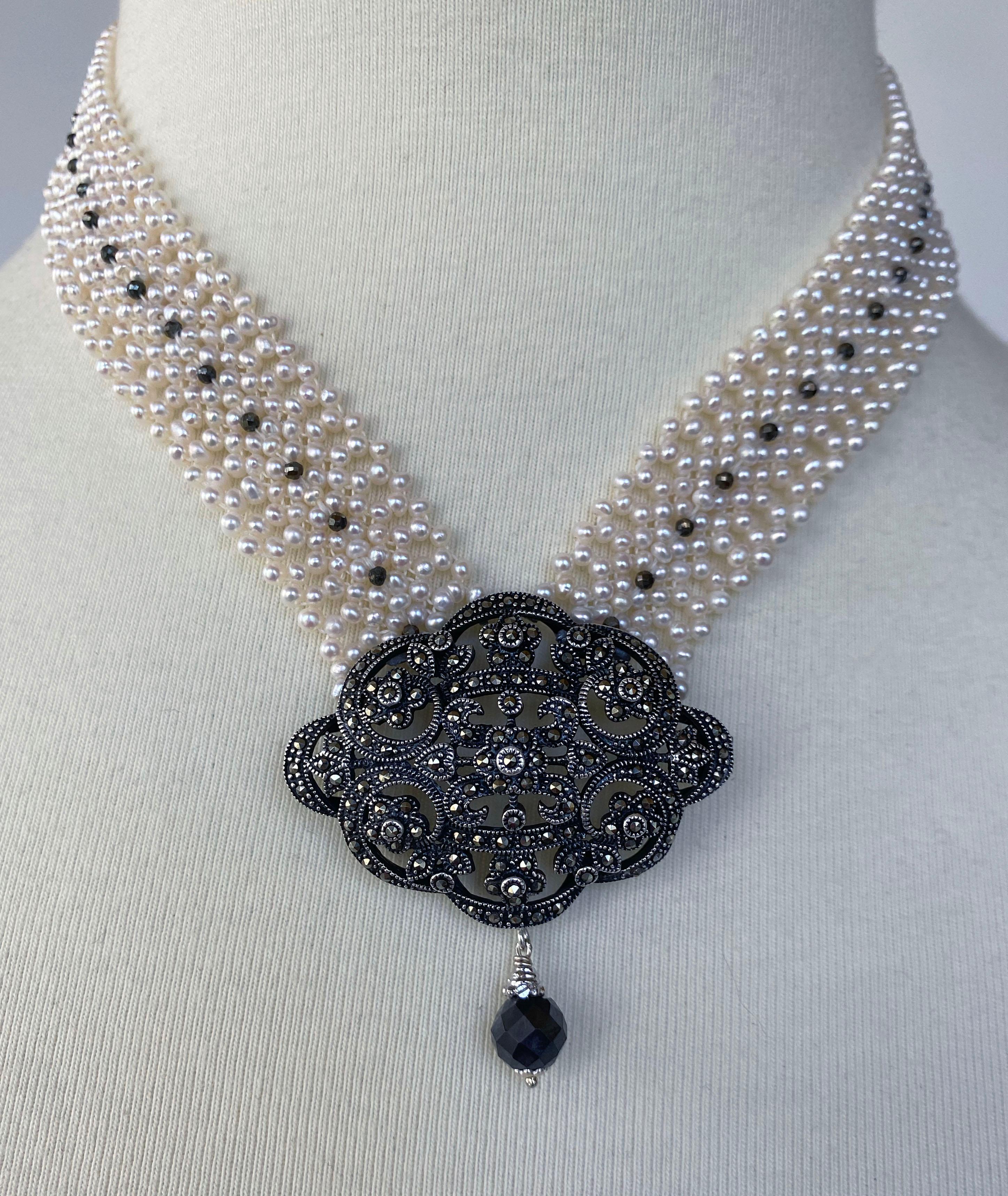 This beautifully hand crafted and woven White Pearl necklace features a Vintage Silver Brooch with Marcasite detailing within. Made with 2mm pearls, this necklace features Black Spinnel, perfectly contrasting and elevating the brooch while adding a