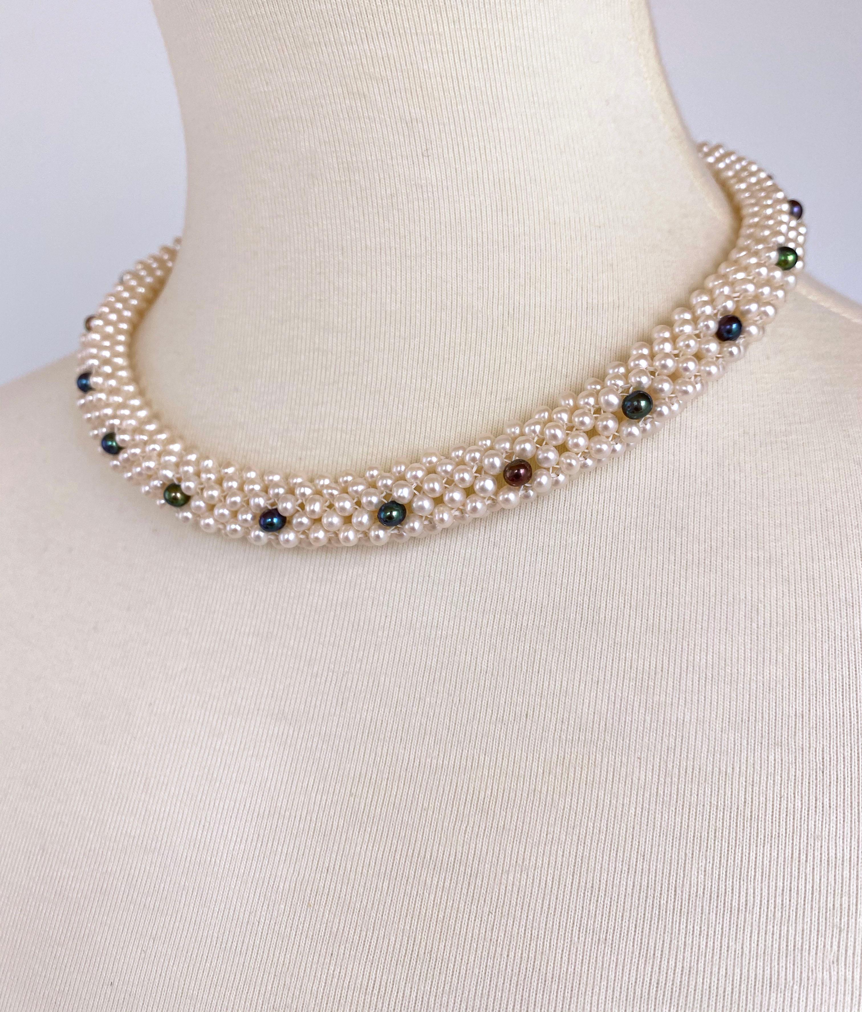 Beautiful piece made by Marina J. This necklace features gorgeous high luster Black and White Pearls, all intricately hand woven into a 3 dimensional lace like design. As shown in photos, the bottom of this piece has been woven flat, allowing it to