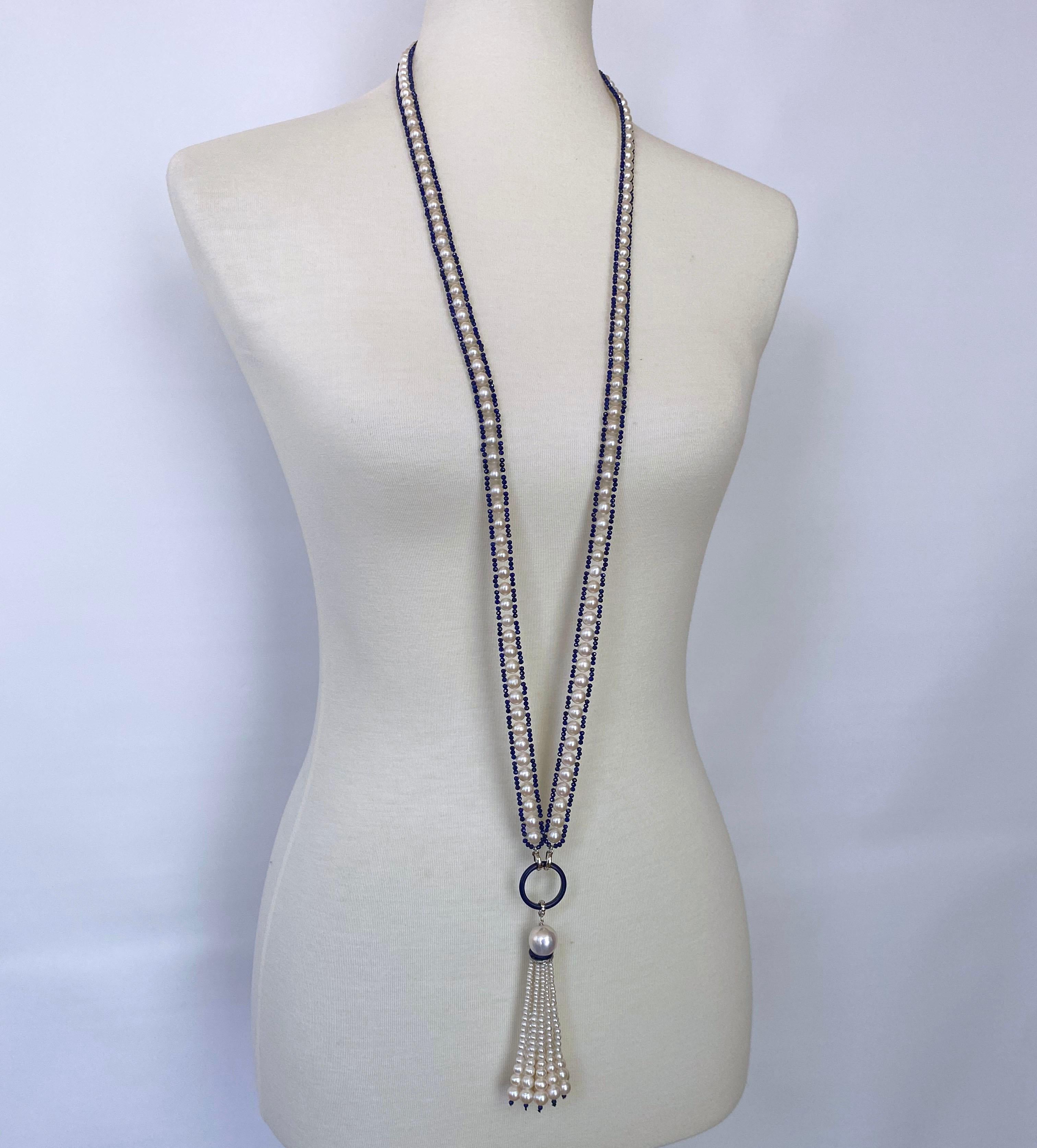 This white pearl and bright blue lapis lazuli beaded sautoir necklace has a removable tassel and 14k white gold clasps. Each white pearl in the sautoir is surrounded by beautiful blue lapis lazuli beads in a ribbon-like design, that is timeless and