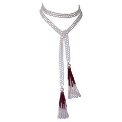 Marina J. Sautoir di perle intrecciate con nappe di rubini e oro giallo 14k
