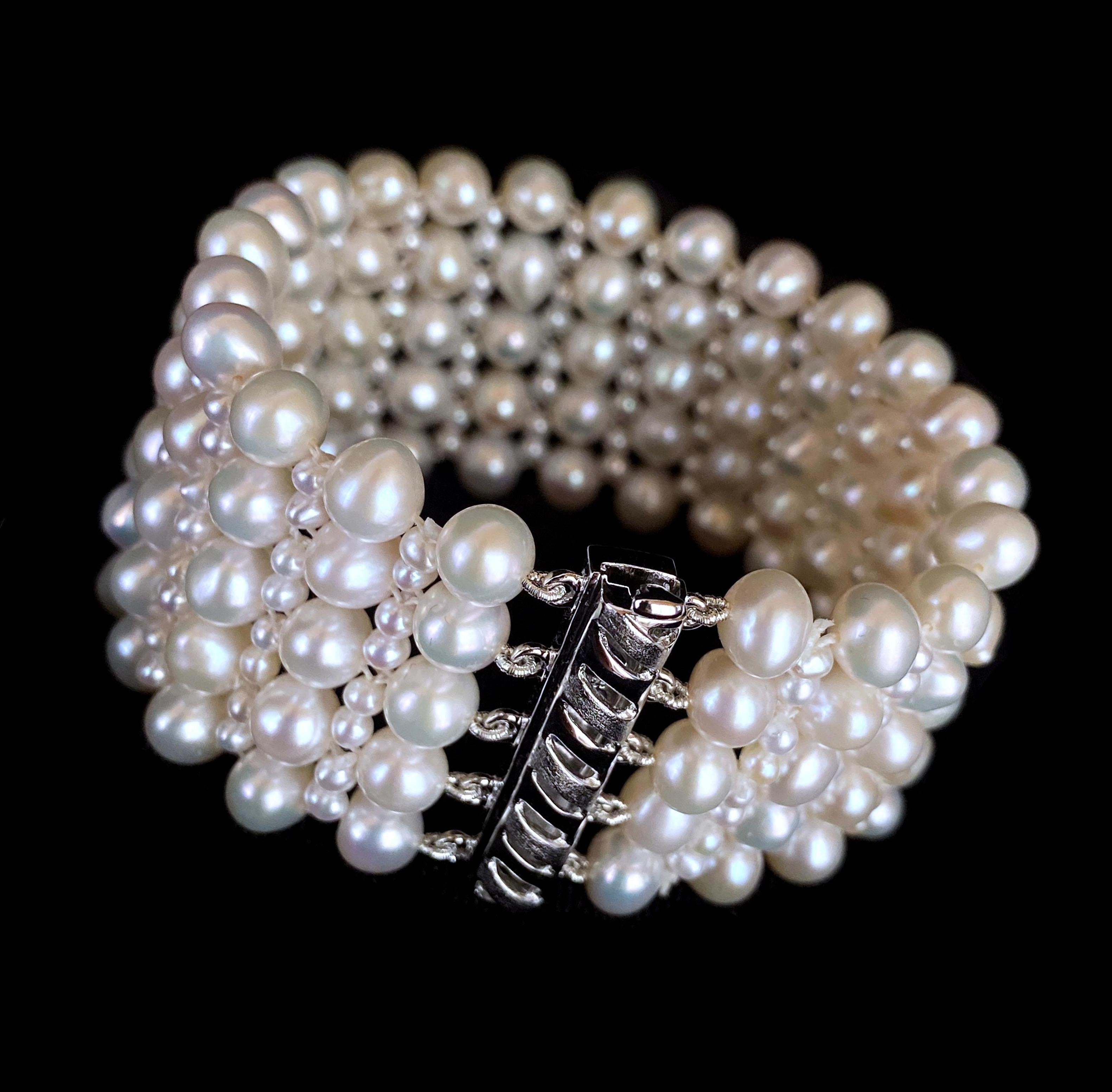 Classic piece by Marina J. This all Pearl bracelet is made of multi shaped Pearls all intricately woven into a tight lace like design. An elegant bracelet perfect for bridal or any formal occasions. Measuring 1 inch thick and 7 inches long, this