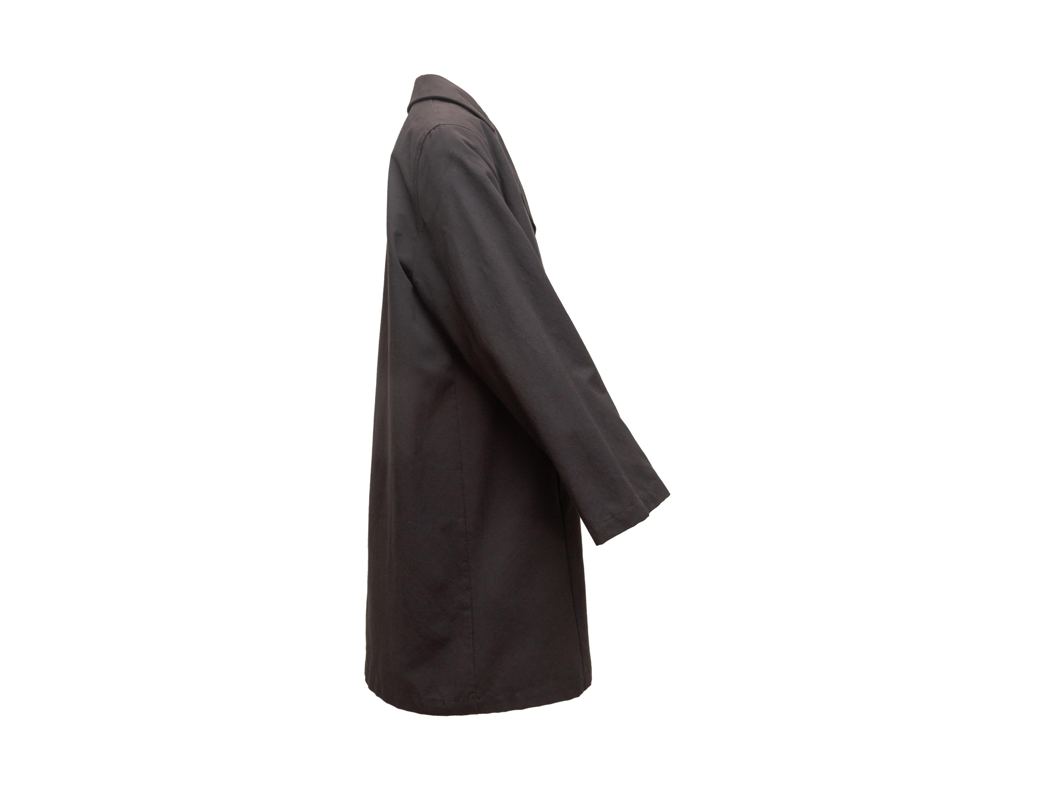 Product details: Black long coat by Marina Rinaldi. Notched lapel. Dual hip pockets. Concealed front closures. Designer size 19. 40