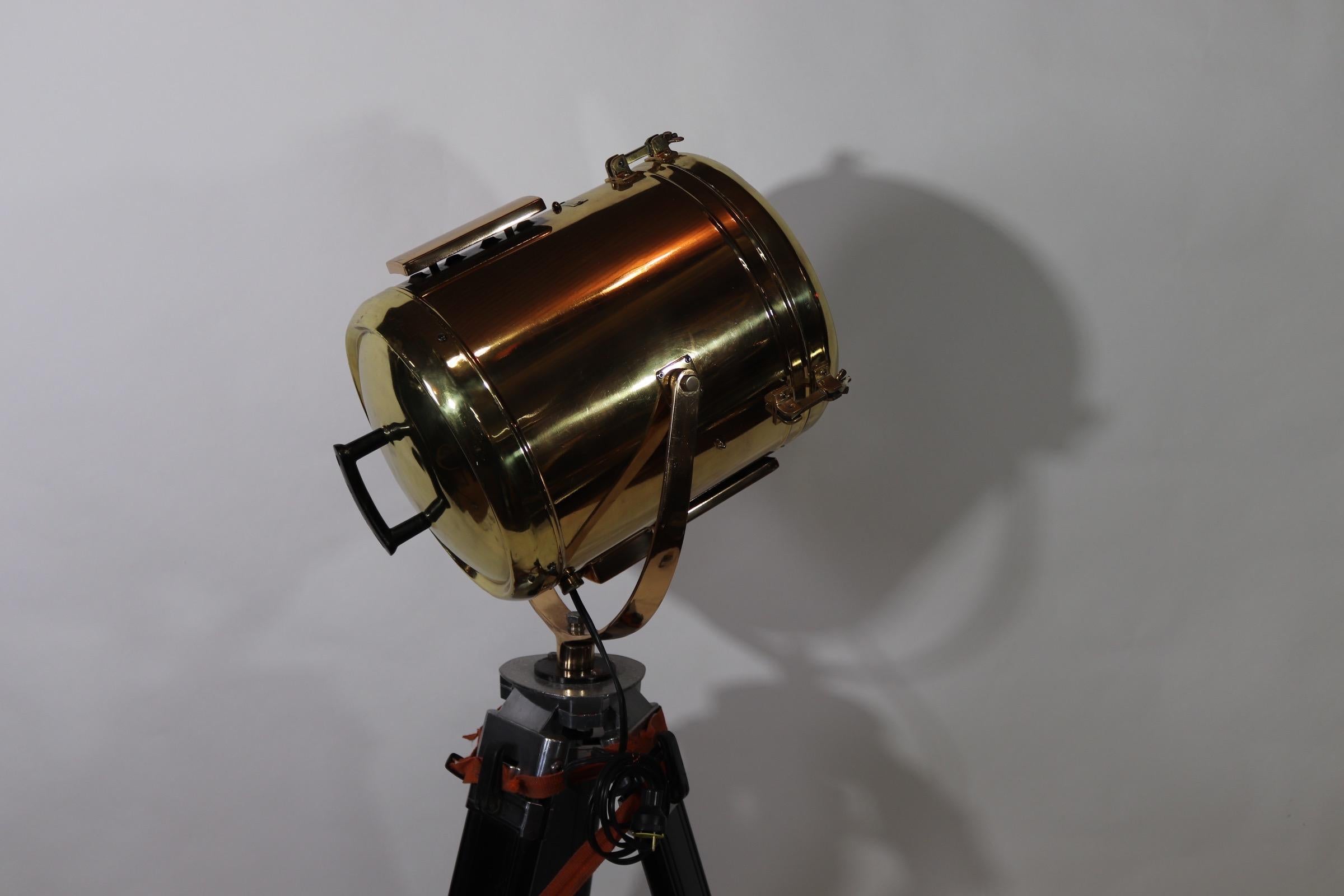 Highly polished and lacquered brass maritime beacon by Perko of Brooklyn, New York. We have fitted this beacon to a vintage tripod that we polished the fittings on and painted black. Rewired with new socket, circa 1980. Weight is 35 pounds.