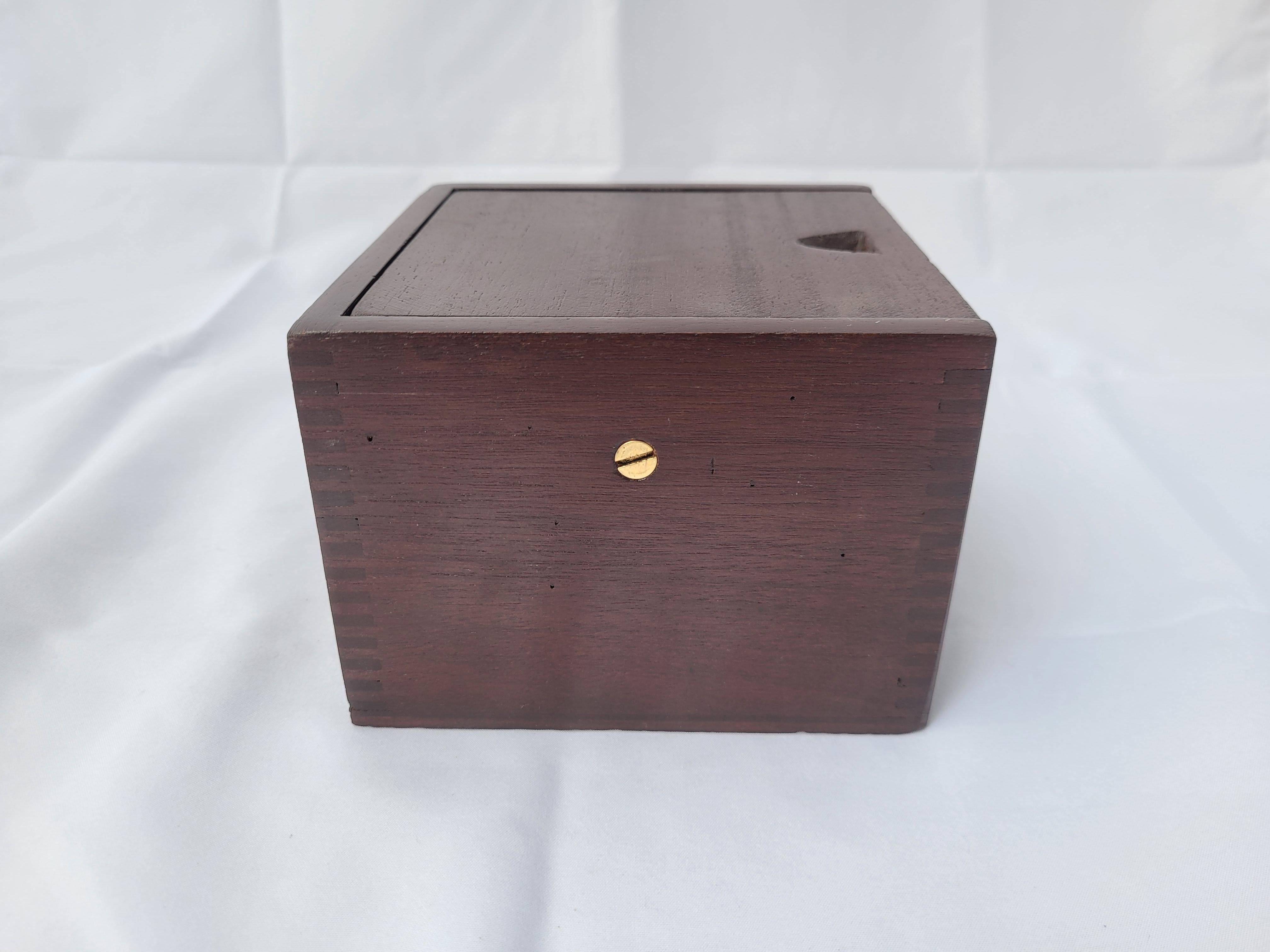 Solid brass boat compass fitted to a dovetailed wood box with rich varnished finish. Compass card is marked Star Pathfinder, Milton Mass. The entire compass has been polished and lacquered to perfection. Awesome nautical accent.

Weight 4