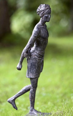Barefoot on the sacred land - bronze sculpture of a walking man
