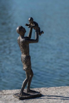 Getting Close to the Sky by Marine de Soos - Bronze sculpture of father and son