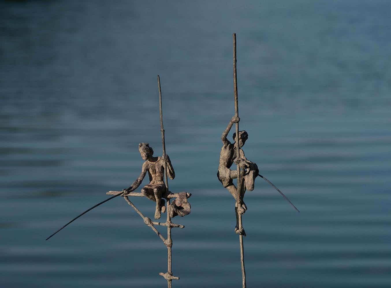 Group of Two Fishermen on Stilt IV is a bronze sculpture by French contemporary artist Marine de Soos, dimensions are 50 × 45 × 32 cm (19.7 × 17.7 × 12.6 in). 
The sculpture is signed and numbered, it is part of a limited edition of 8 editions + 4