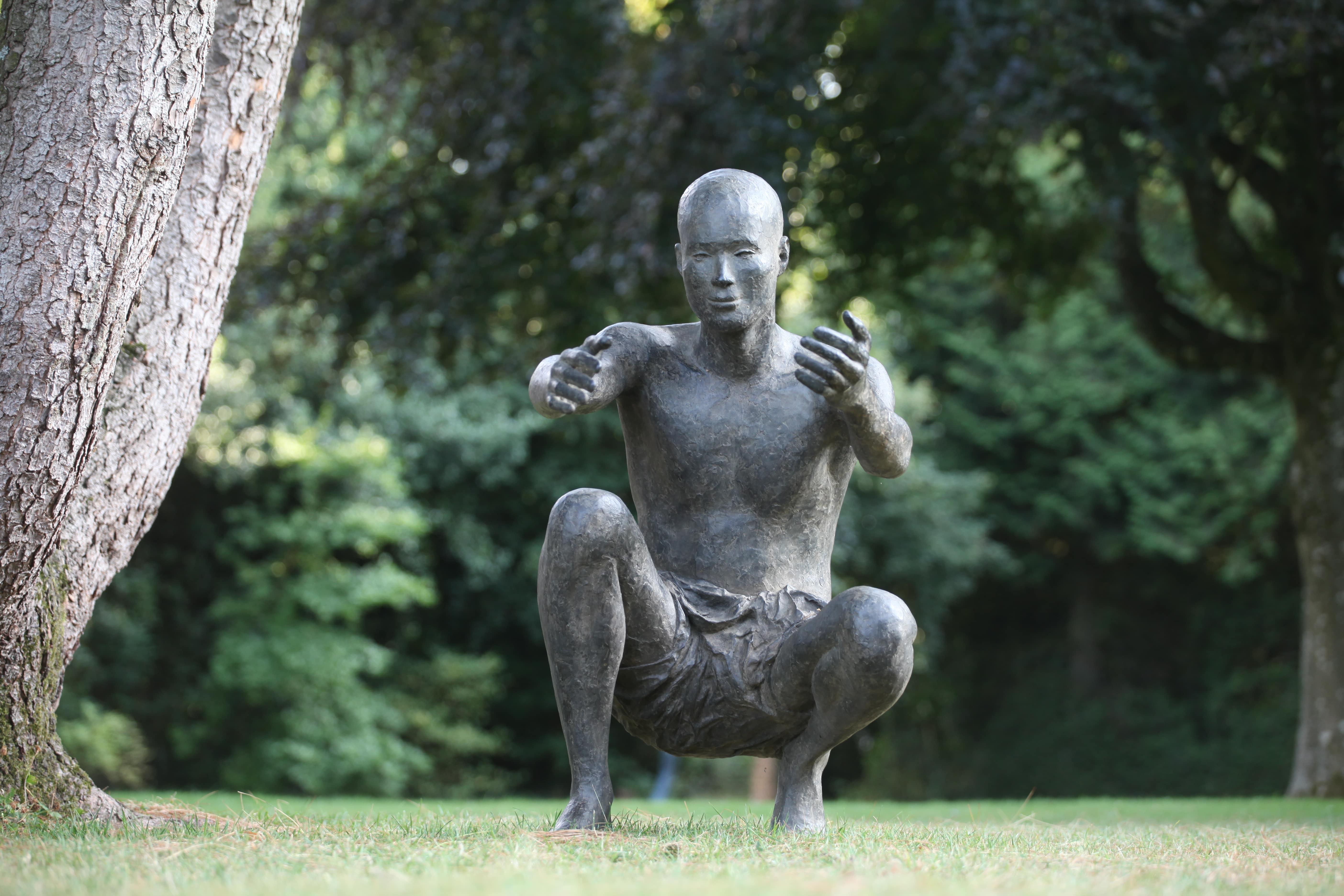 The Welcome by Marine de Soos - Outdoor bronze sculpture, squatting male figure For Sale 2