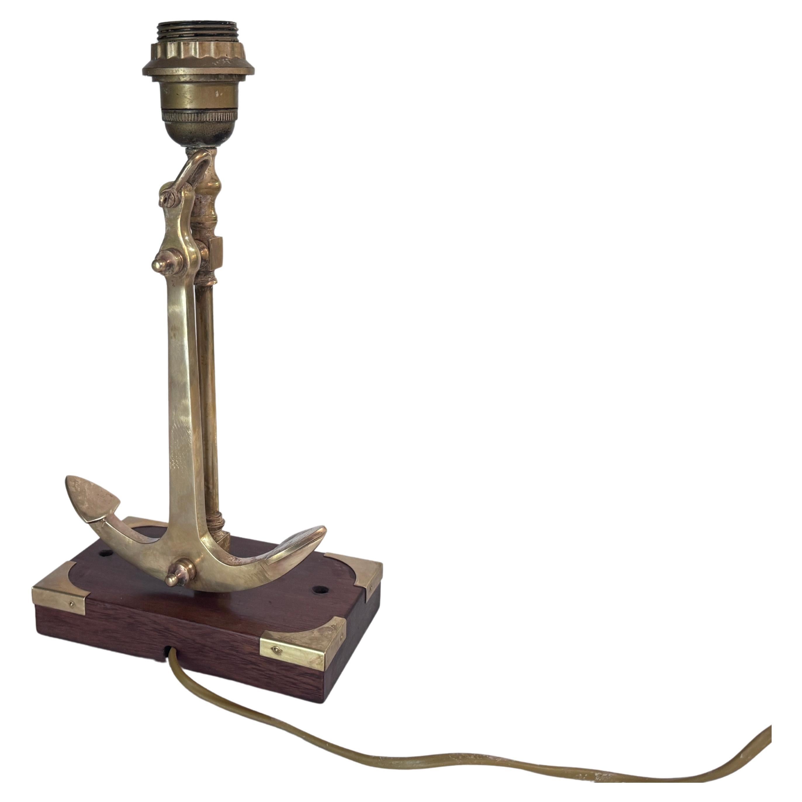 This lamp is a beautiful Marine style lamp, it is made of Brass and Wood. It was made in the 1960s in France, and is in good condition, its electrification is compatible with the United States.

US PLUG ADAPTATOR WILL BE FURNISHED FOR FREE TO THE US