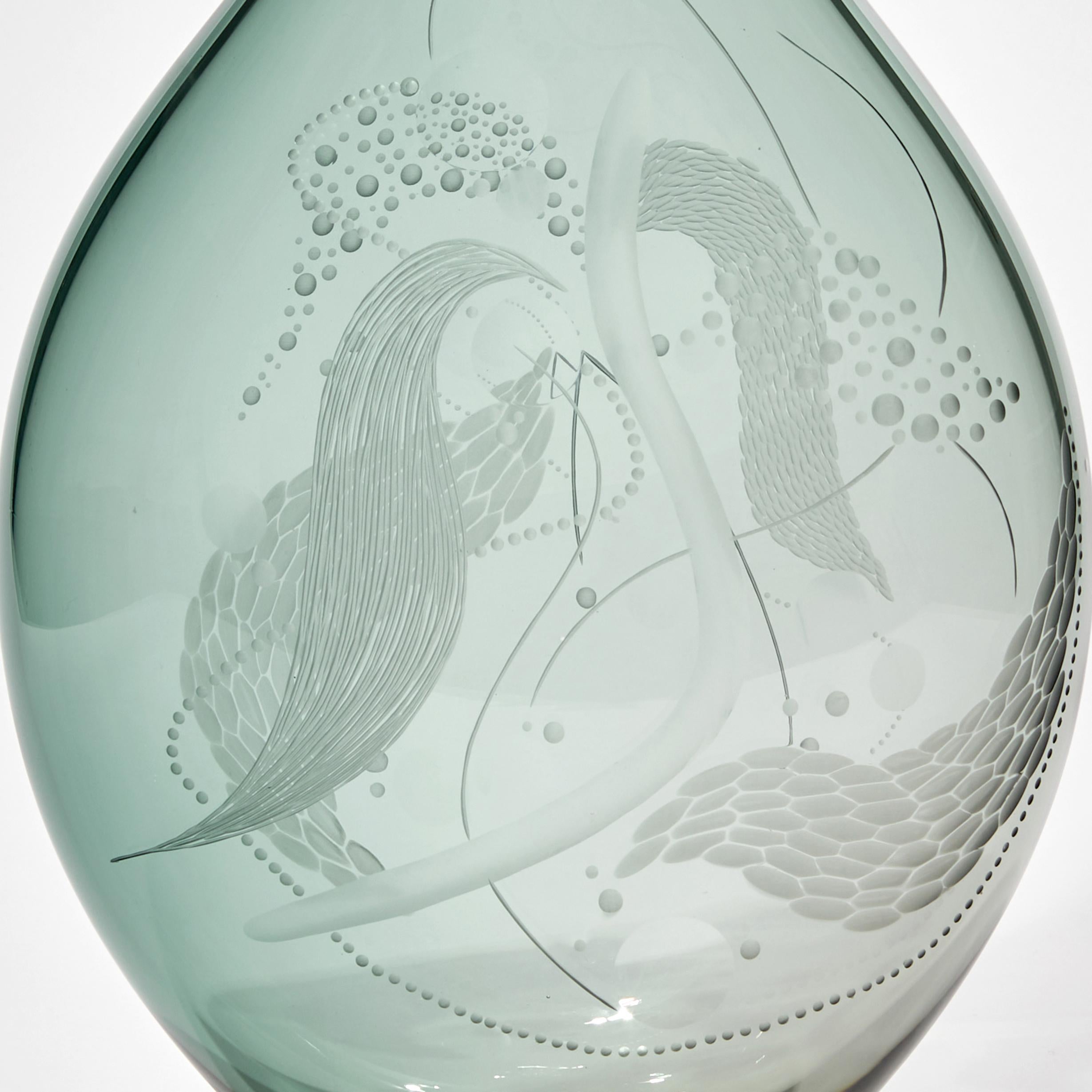 Mariniere vase II is a unique art glass sculptural vessel in soft celadon green, covered in the British artist, Heather Gillespie's signature engraving. Treating the three-dimensional object as her canvas, no two pieces are the same.

If one were