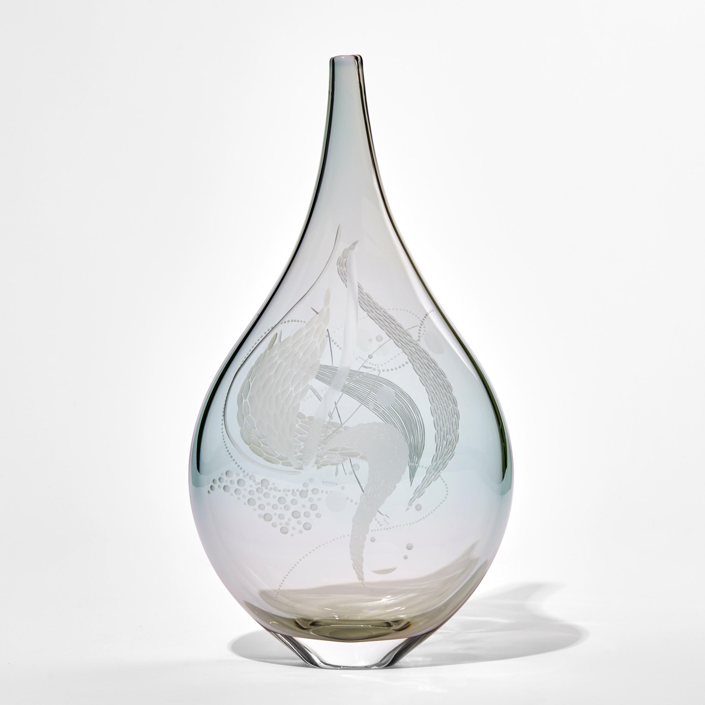 Mariniere vase III is a unique art glass sculptural vessel in soft grey and green, covered in the British artist, Heather Gillespie's signature engraving. Treating the three-dimensional object as her canvas, no two pieces are the same.

If one