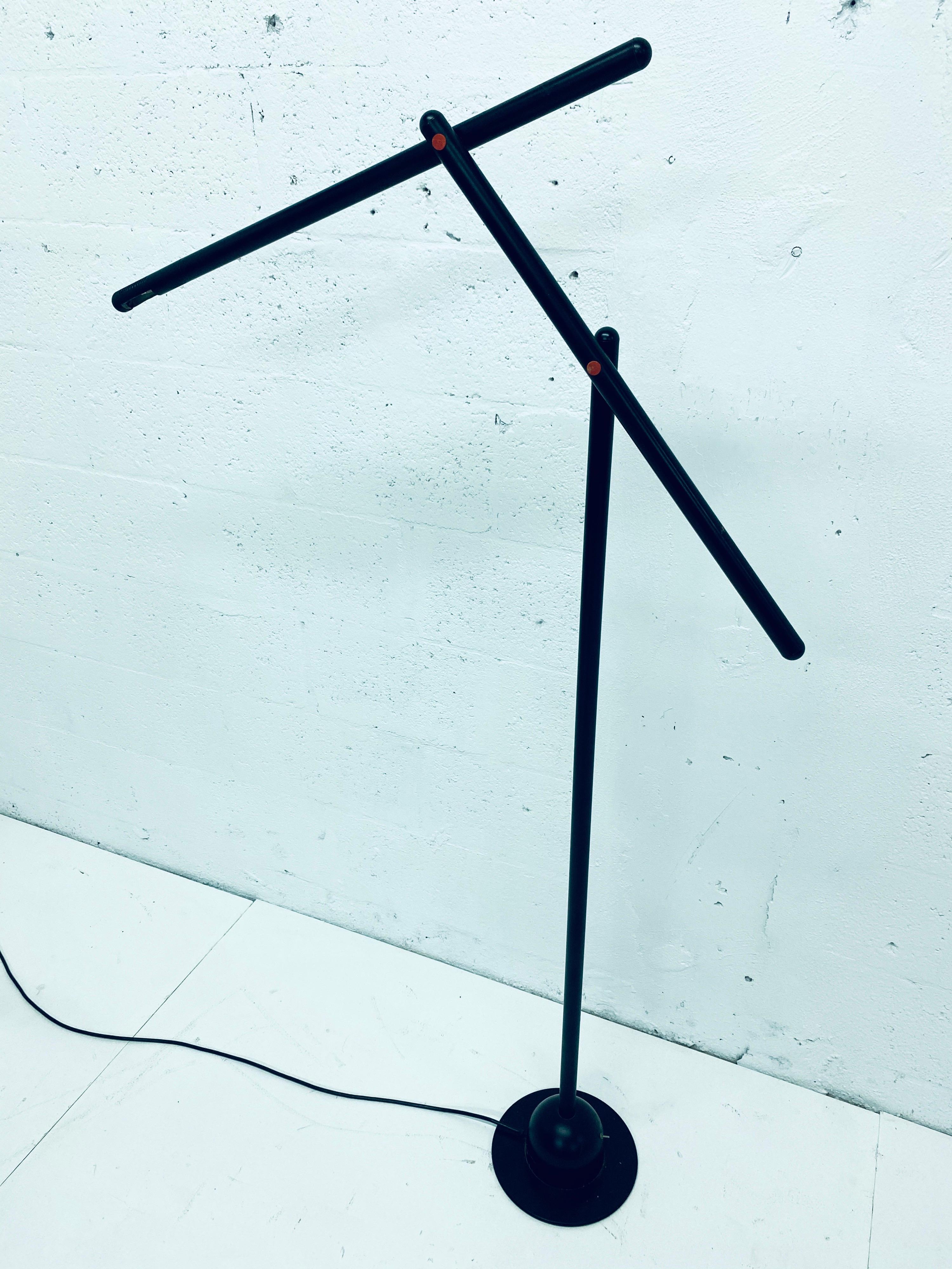 Rare “Mira” black painted aluminum with red accent floor lamp designed by Mario Arnaboldi for Programmaluce, Italy. Toggles between high and low light.