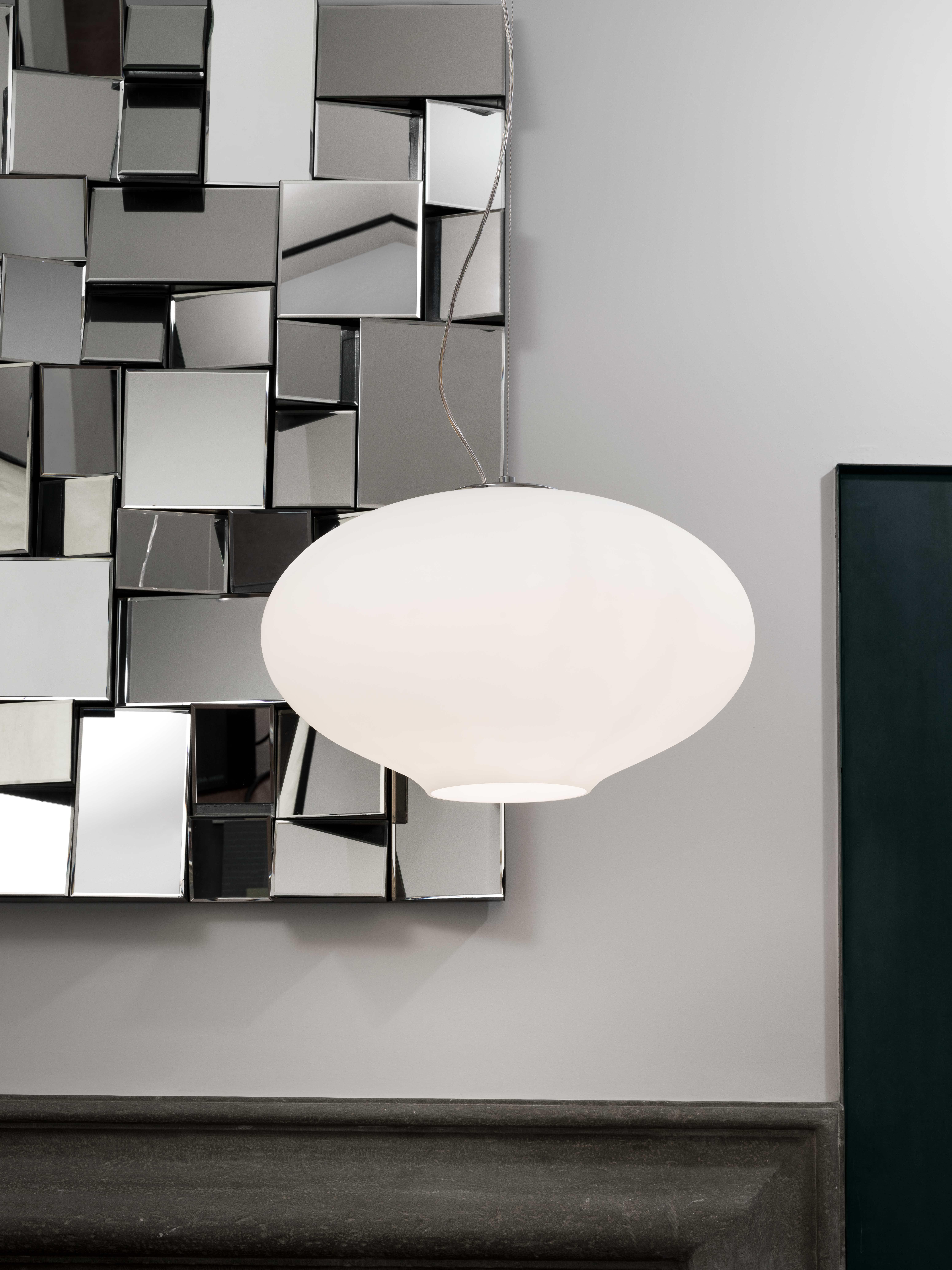 Mario Barbaglia 'Anita' Pendant Lamp in Blown Opal Glass and Chrome for Nemo

This eloquently designed pendant lamp by Mario Barbaglia is executed in triplex blown opal glass and chrome. The pendant's oval shape features a slight compression which