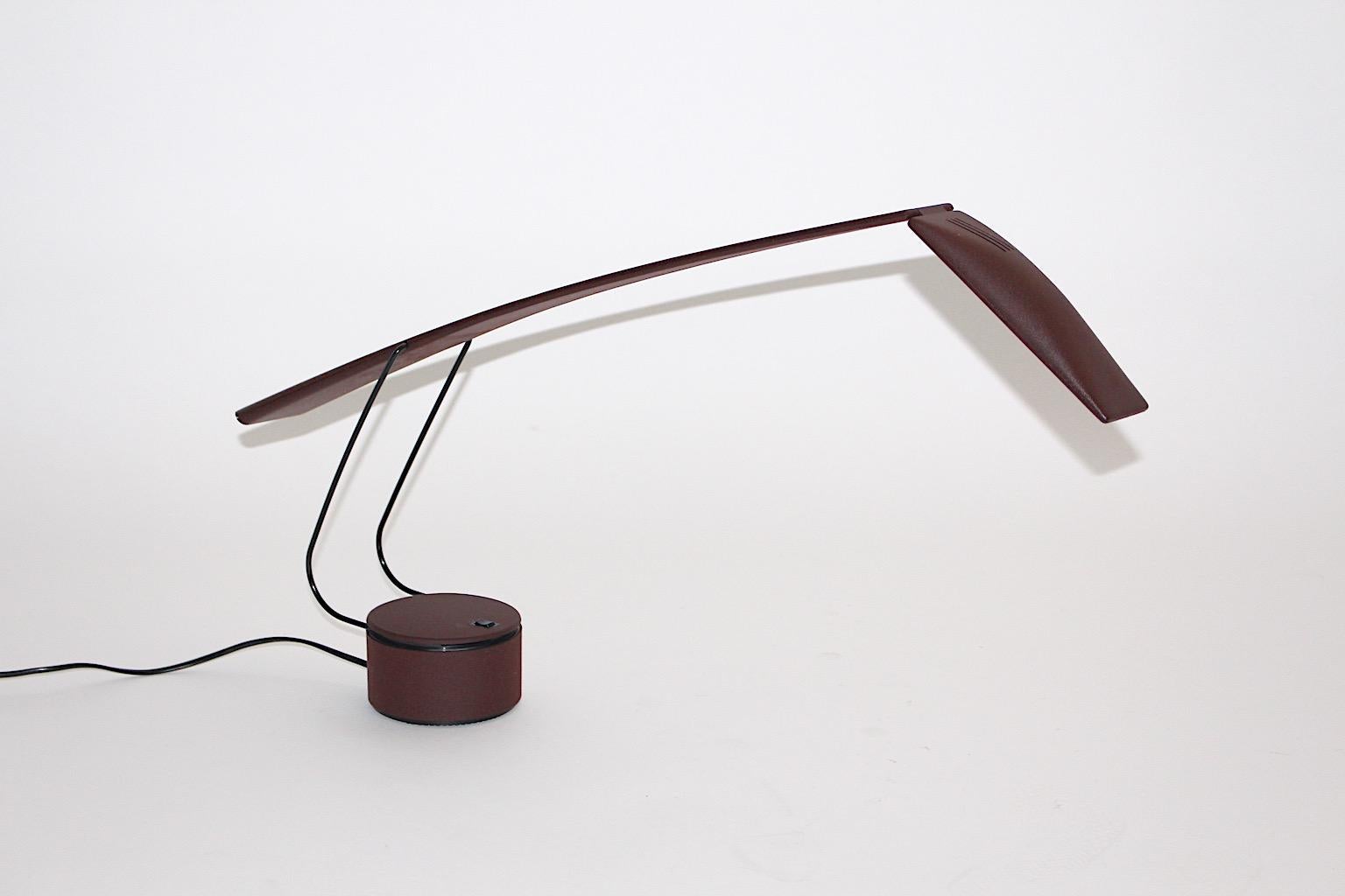 A Mario Barbaglia & Marco Colombo dove vintage desk lamp for Paf Studio 1980s Italy, which was made of brown plastic and metal.
The desk lamp is adjustable from up to down and rotates on its base. One halogen bulb and an on/off switch. So it allows