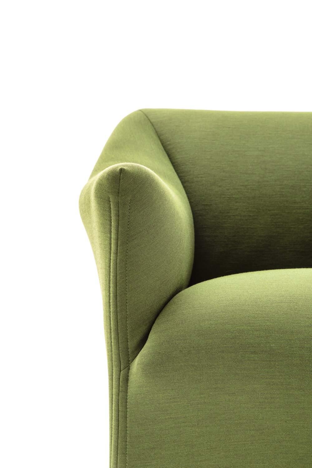 Price dependent on the chosen material/color. A soft upholstered armchair with optional casters by Mario Bellini for the dining room or living room featuring a simple, inviting, reassuring, authentic style, a testament to the exceptional