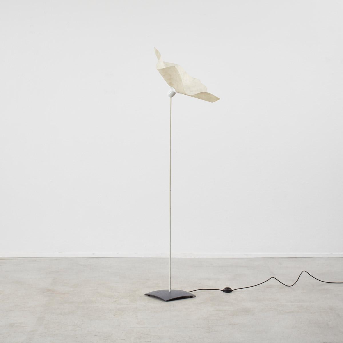 Italian architect Mario Bellini (1935-) is well known for creating powerful, thoughtful and creative pieces of design. The long sleek stem of the Area floor lamps supports a ruffled shade, reflecting that of a flower in bloom. The head and shade of