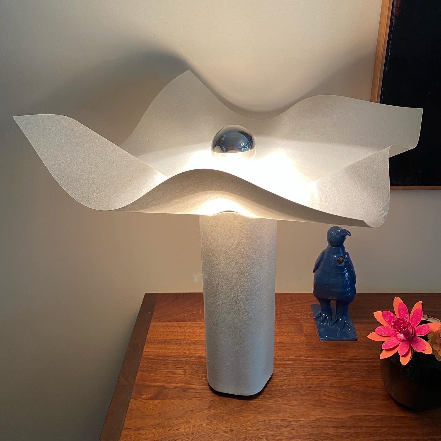 Beautiful sculpted organic form to the ceramic base of this Mario Bellini lamp.