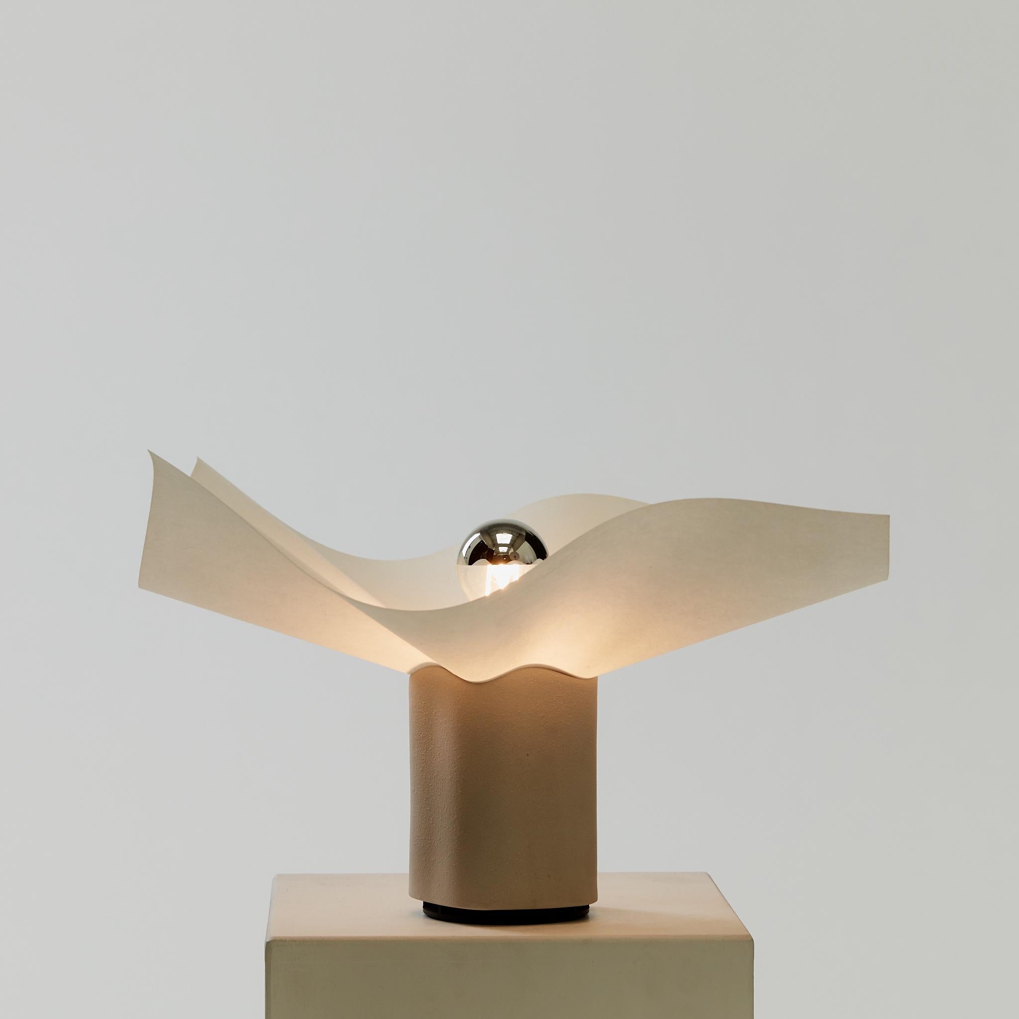 The iconic Area uplighter by Mario Bellini for Artemide features a sculptured porcelain base with textured finish and parchment paper shade for an ambient, diffused light.

PAT tested with new UK plug. No longer in production.

Mario Bellini is