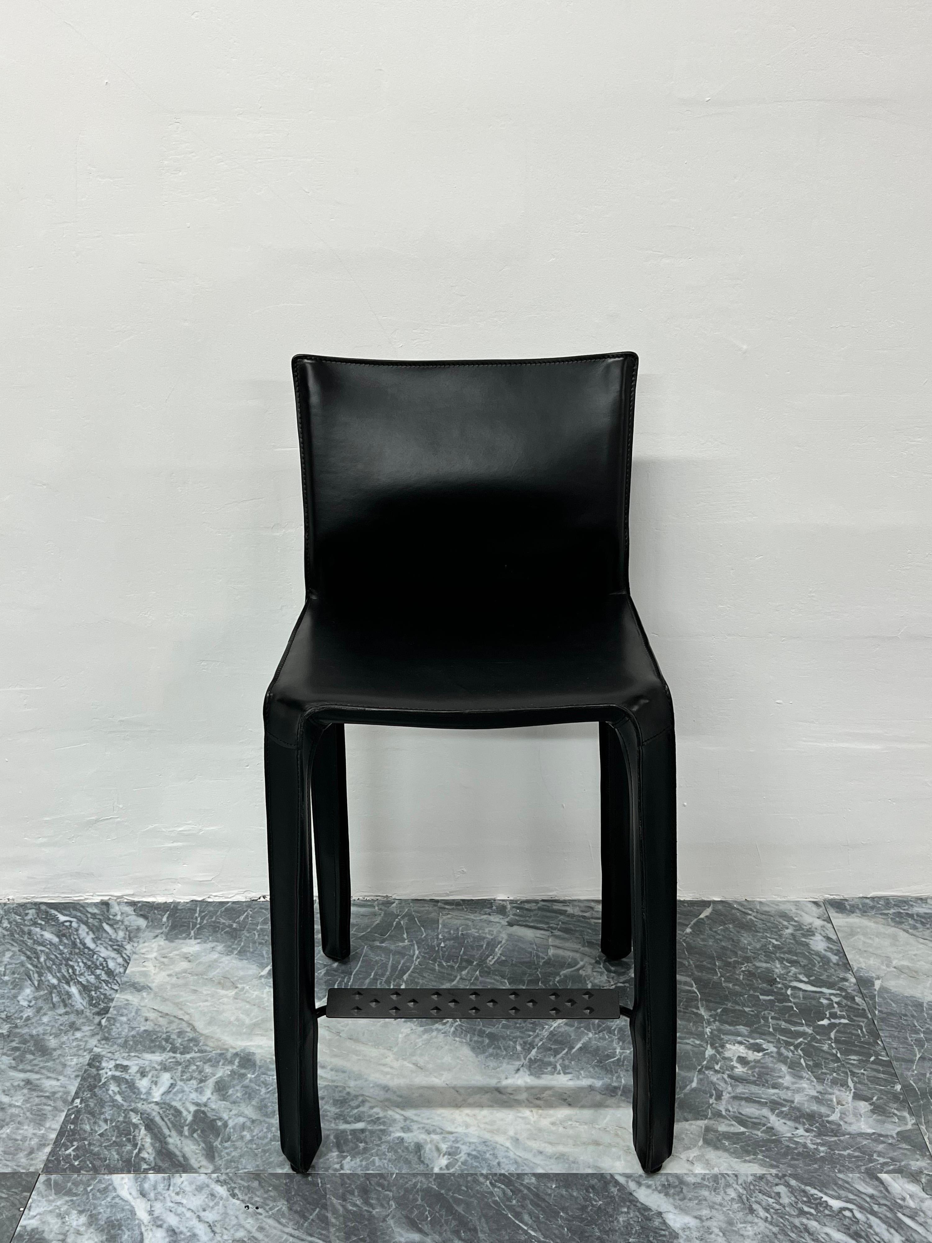 Black leather CAB 410 counter height stool designed by Mario Bellini for Cassina. 

“This was a new kind of chair, constructed totally out of leather, much cloned since then.” Thus Mario Bellini describes Cab, a best-seller that he designed in the