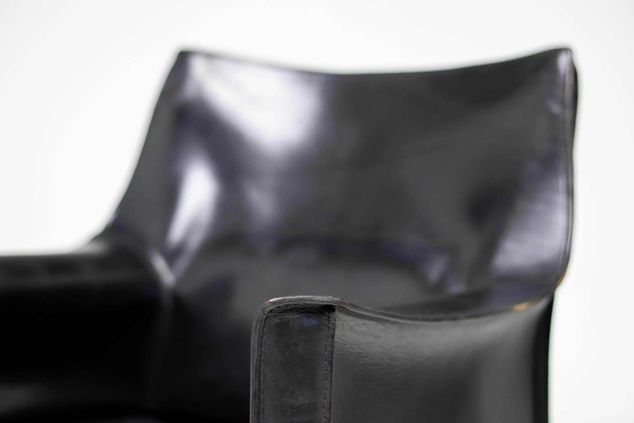Mario Bellini for Cassina CAB 413 chair in black Italian leather, made in Italy, circa 1990.
High-quality chair consisting of handstitched natural leather upholstery wrapped over internal steel frame. The only additional reinforcement is provided