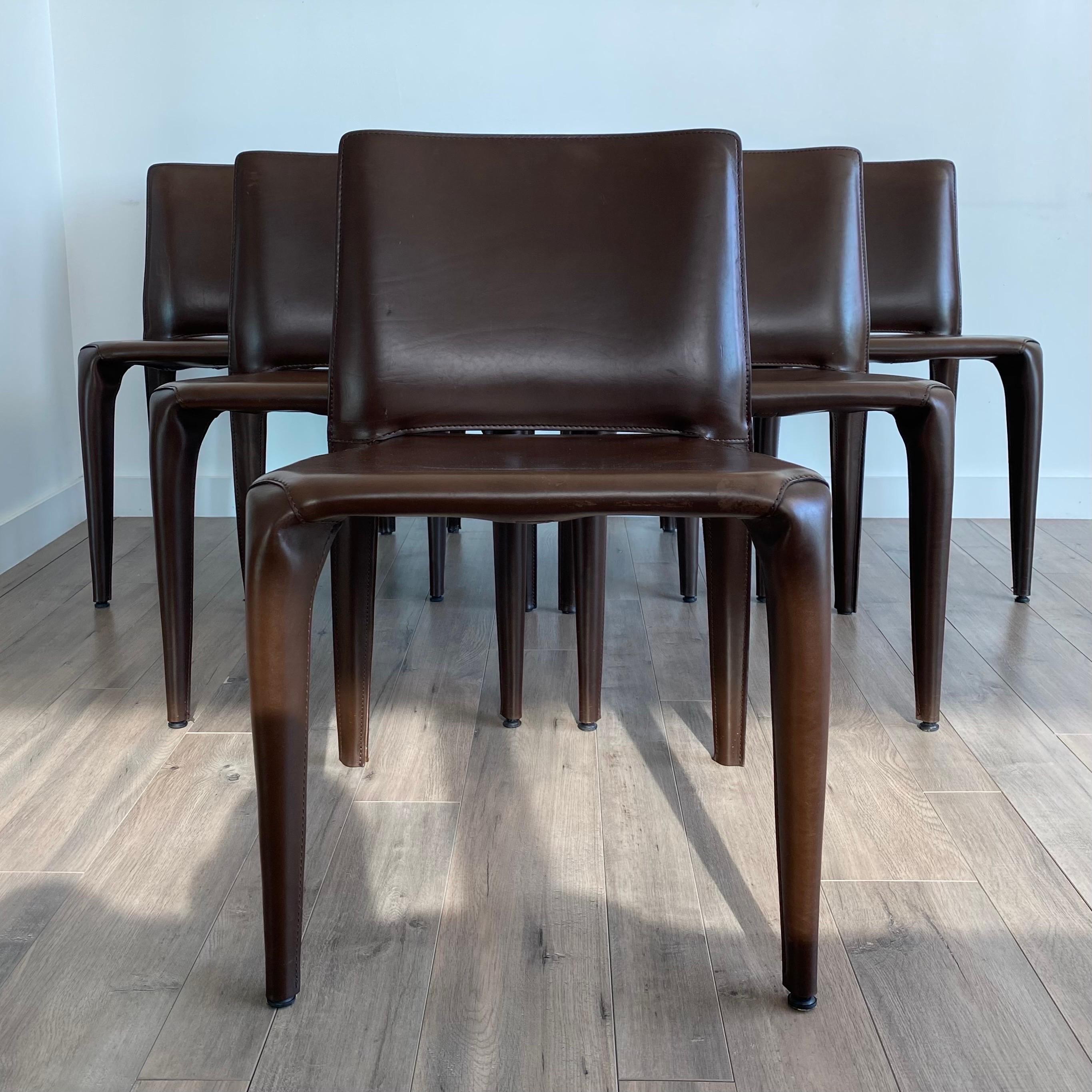 Sophisticated top-stitching outlines the contours of this elegant design chair demonstrating the successful fusion of artisan craftsmanship and industrial production, also found in the curved edges that allow the chairs to be stacked for a