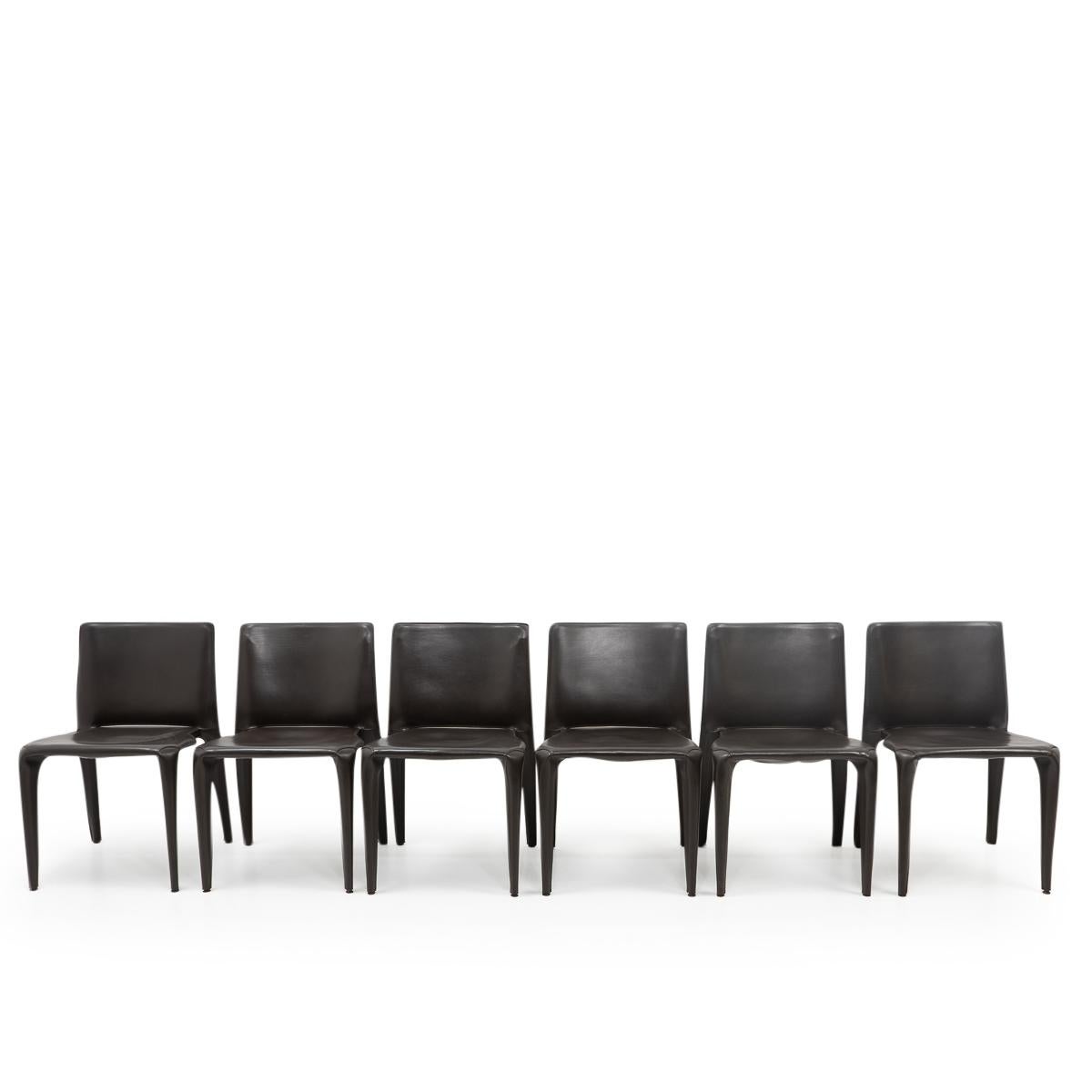 Set of six Bull dining chairs in dark brown leather by Mario Bellini for Cassina.

The Bull chair is built up as a tubular frame over which thick saddle leather is fitted; the leather skin is kept in place with zippers on the inside legs, very