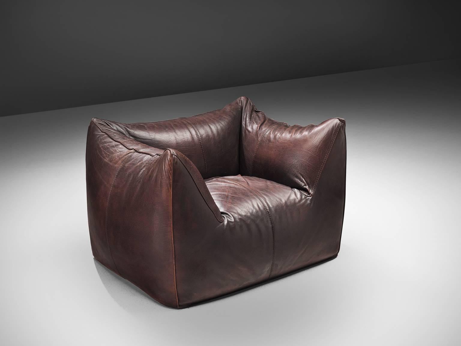 Mario Bellini for B & B Italia, 'Le Bambole' lounge chair, brown leather, Italy, 1972. 

This comfortable dark brown lounge chair is bulky and playful, shaped as if it is merely a large cushion and the accompanying feeling is the same. It is