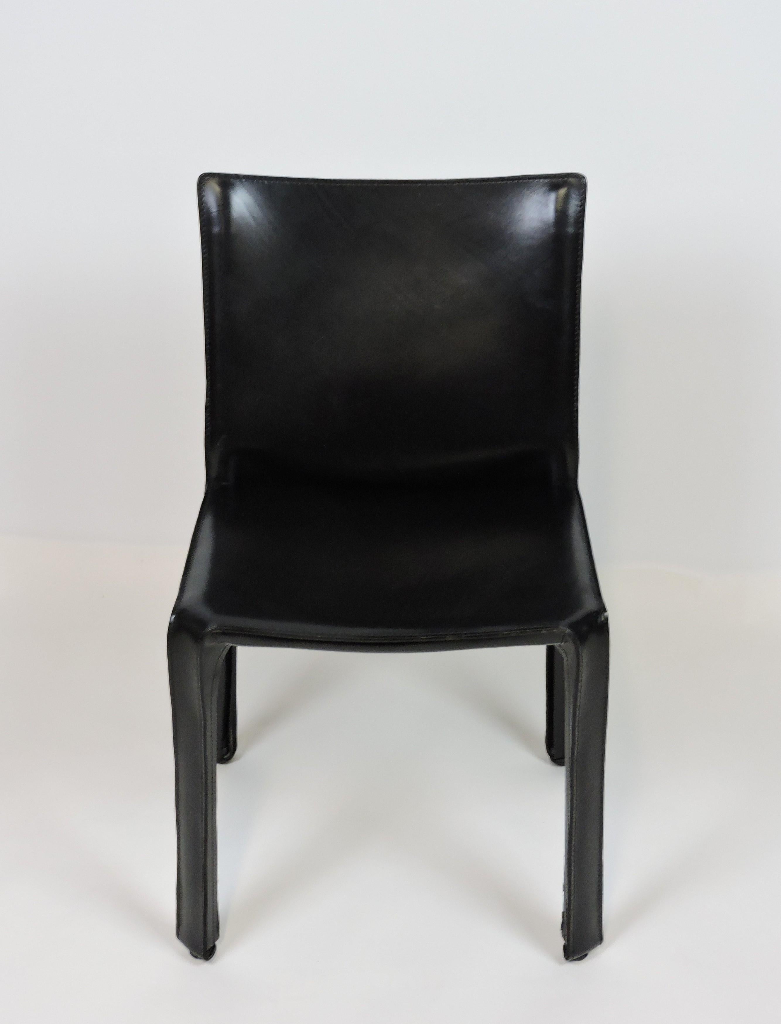 Classic and unique CAB 412 chair designed by Mario Bellini in 1977. This chair is constructed of high quality black Italian leather that zips over a steel frame. Great for use as a side, dining, or office chair. Cassina stamp on bottom.
 