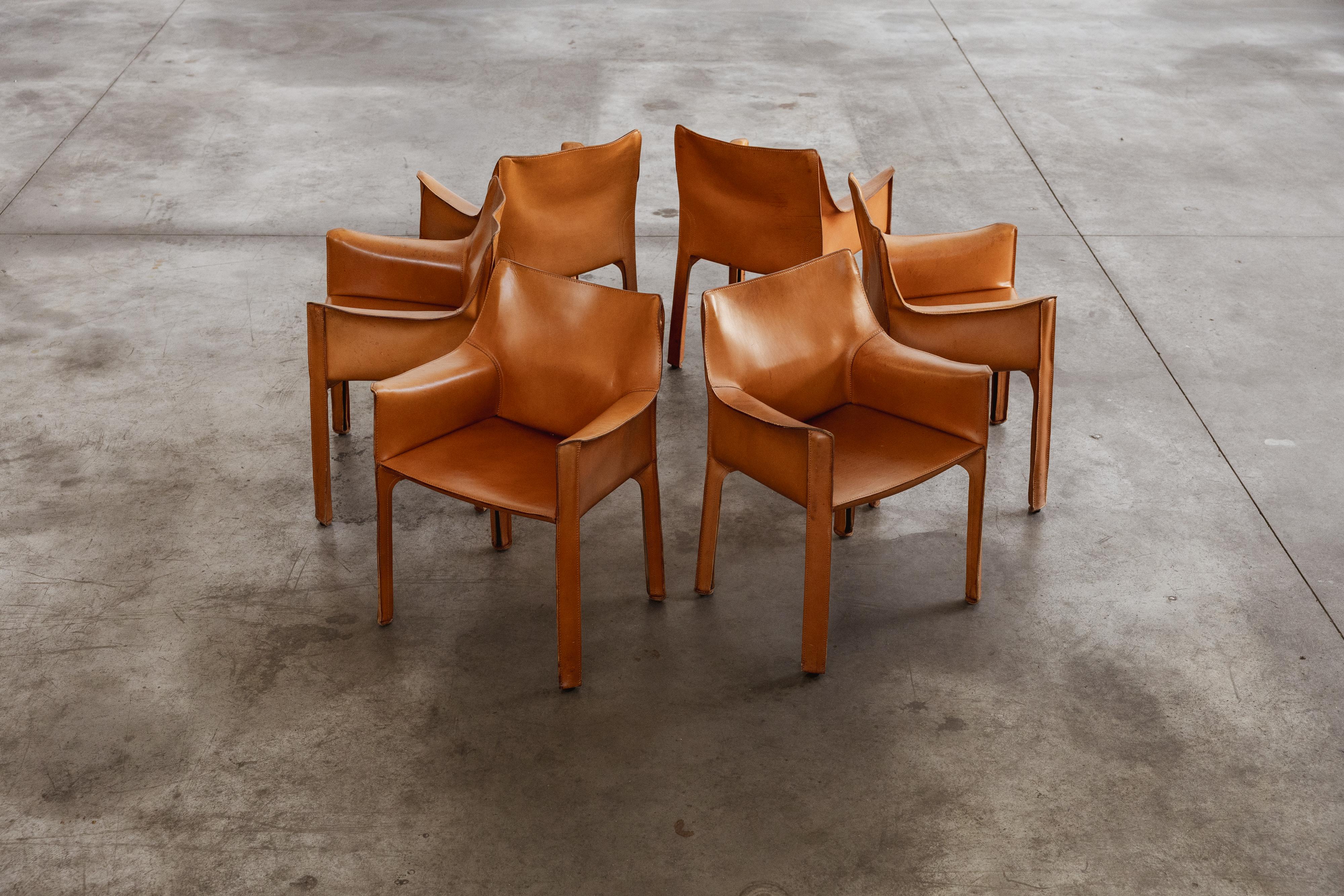 Mario Bellini “CAB 413” dining chairs for Cassina, patinated cognac leather, Italy, 1977, set of six

The 