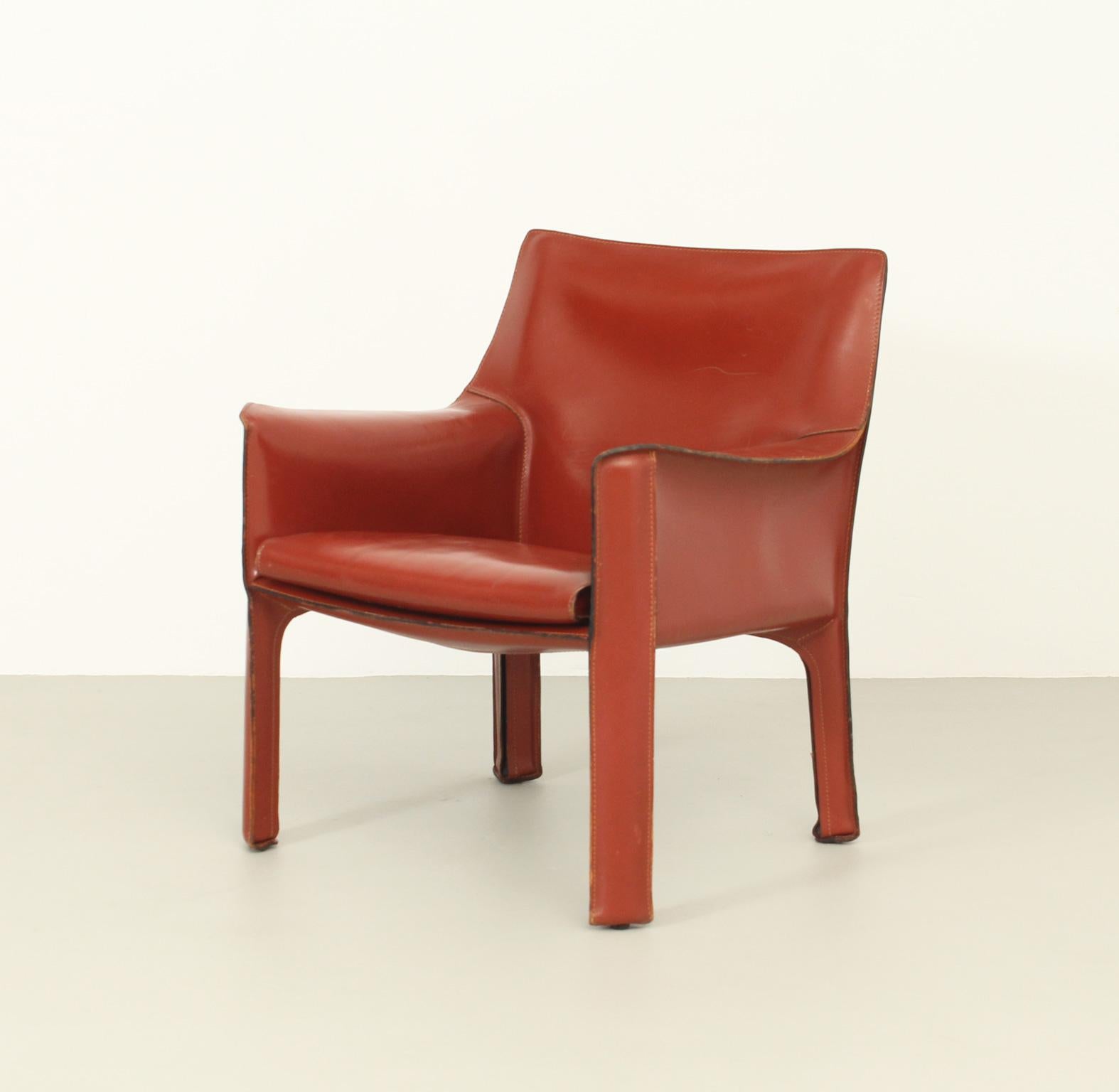 Armchair Cab model 414 designed by Mario Bellini in 1982 for Cassina, Italy. Steel frame covered with a thick red leather. Stamped with Cassina logo in the back of the seat.