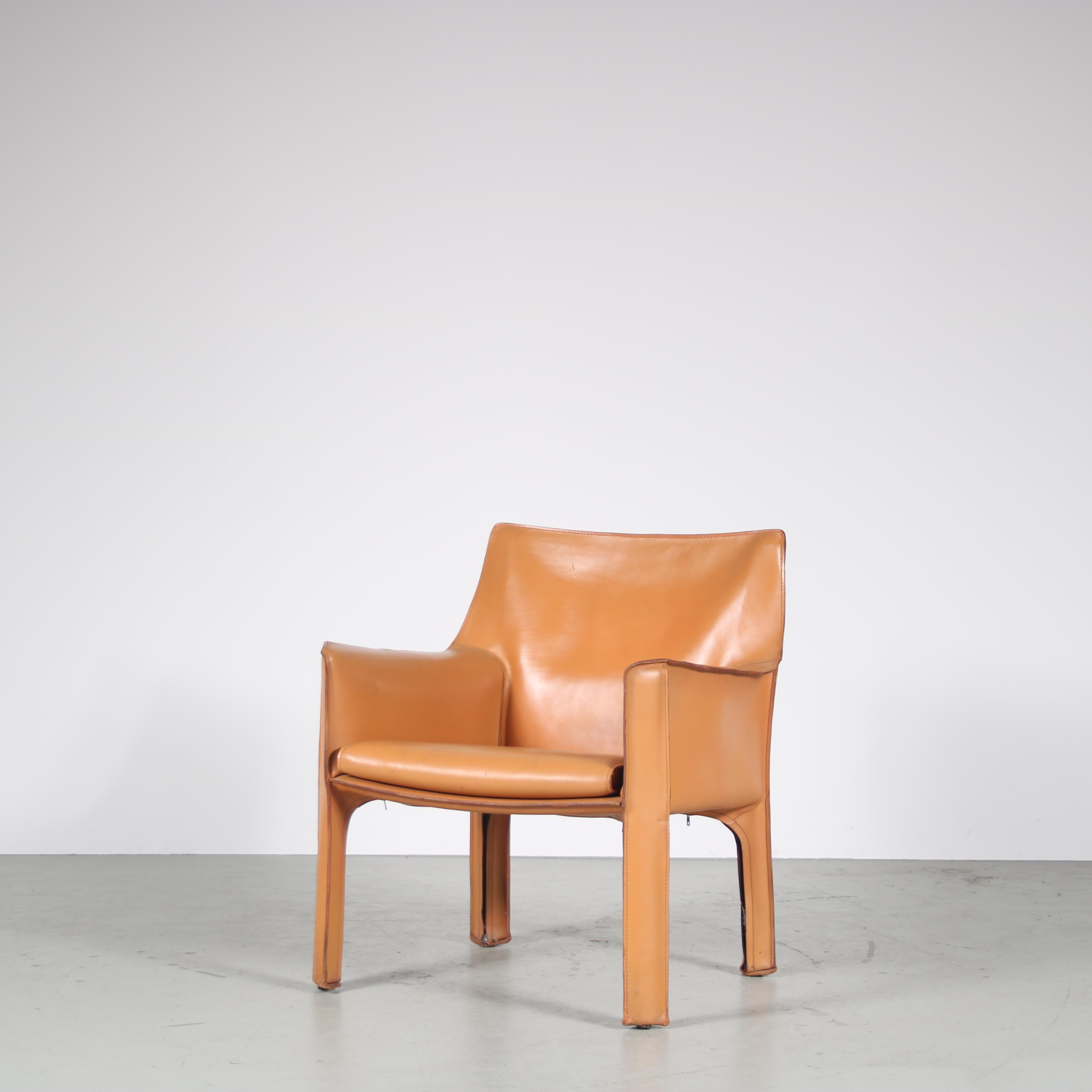 The iconic “Cab” chair / model 414, is a design by Mario Bellini, manufactured by Cassina in Italy around 1980.

This eye-catching chair is fully upholstered in high quality cognac leather, nicely finished with a beautiful stitching. Being