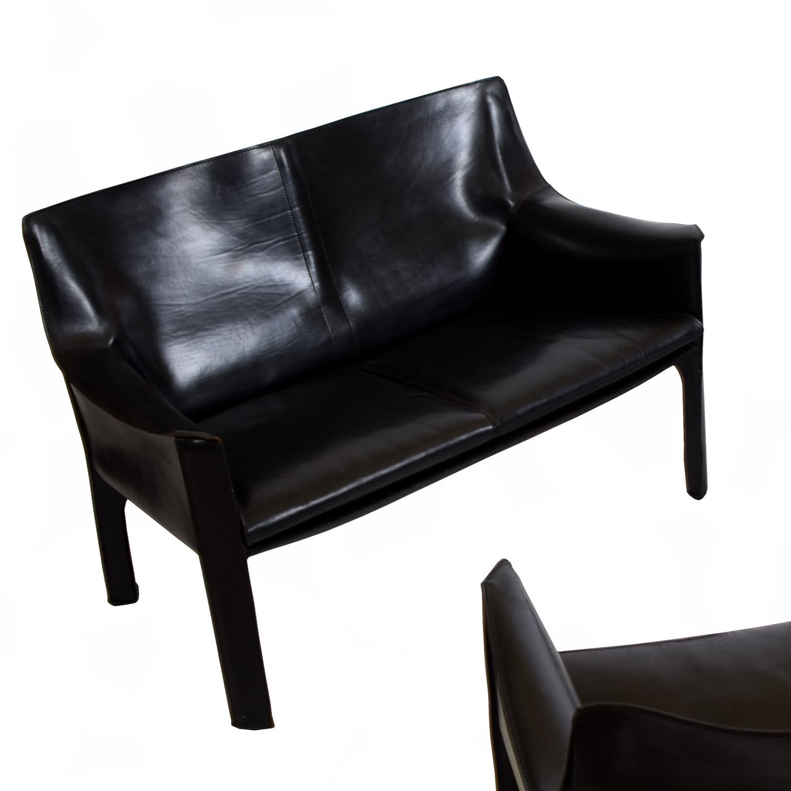 Arm chairs SOLD  settee designed by Mario Bellini in 1979 for Cassina, Italy. Steel frame covered with a thick black leather. Stamped with Cassina logo.