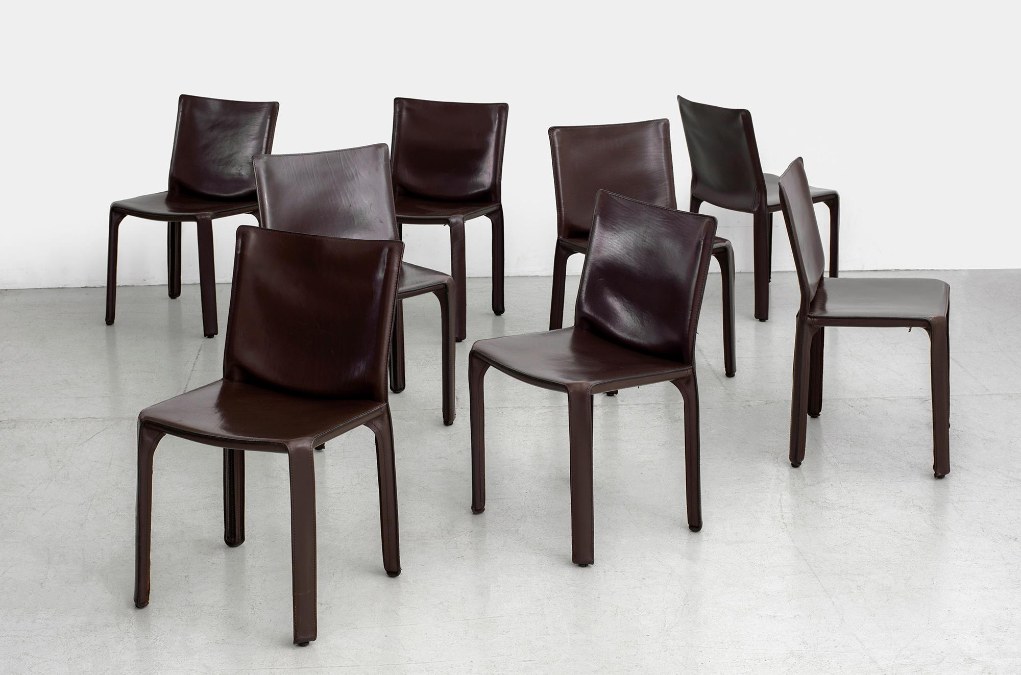 Classic leather Cab chairs by Mario Bellini for Cassina 
Wonderful chocolate brown leather - 
Excellent vintage condition.
Priced individually. 
Set of 8 available.