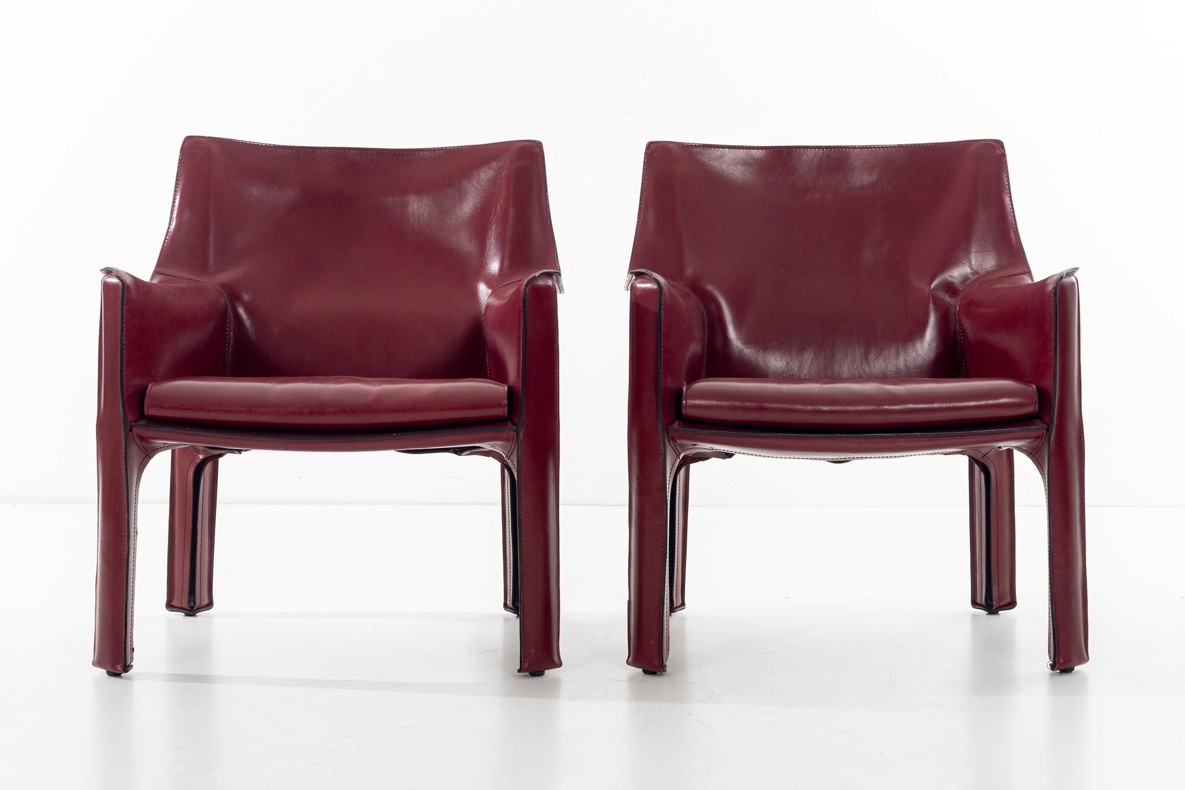Bellini for Cassina, cab chairs in oxblood Italian leather, high-quality chairs consists of a leather cover stretched over a minimal tubular steel frame. The only additional reinforcement is provided by a rubber membrane plate that supports the
