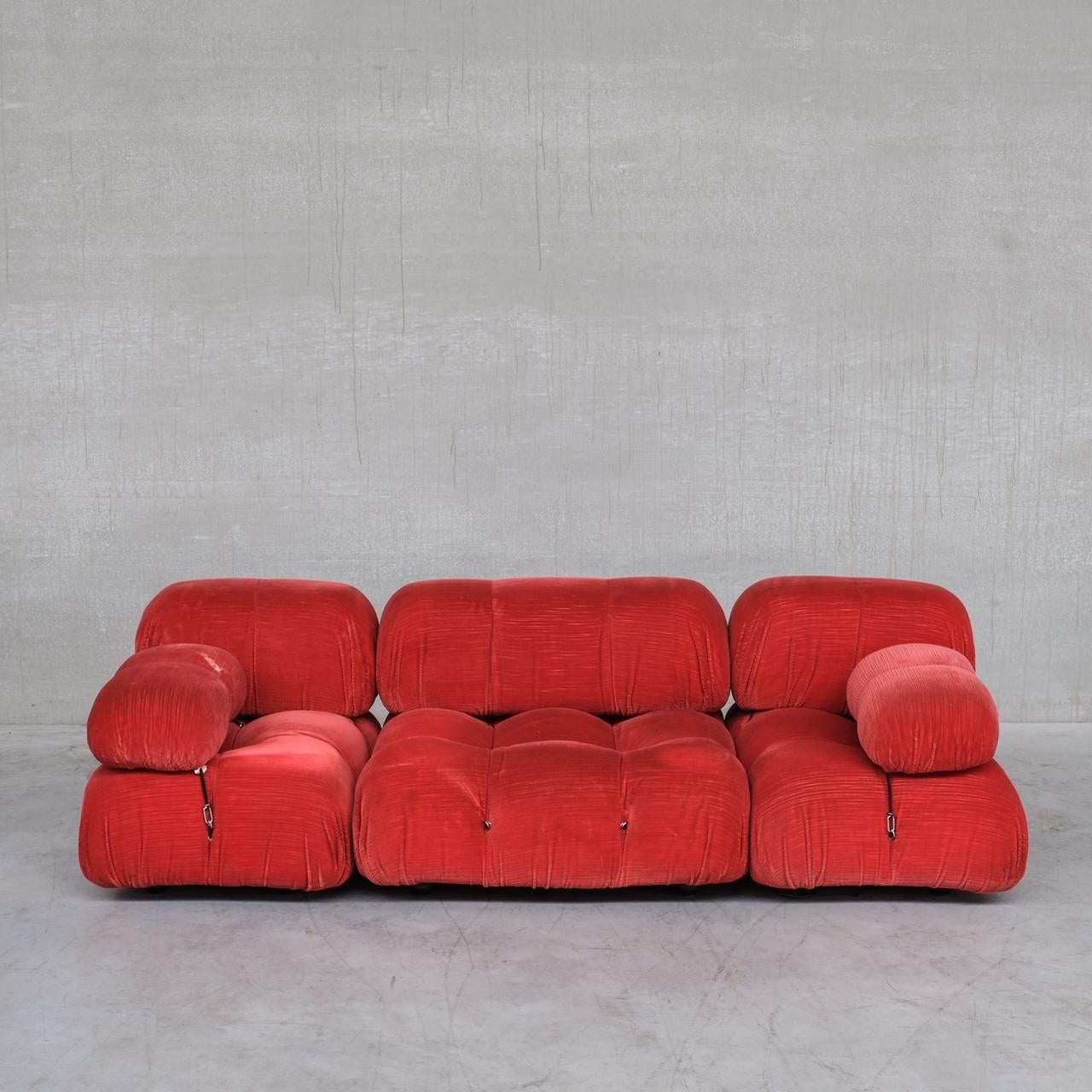 A three piece modular sofa by Mario Bellini, for B&B Italy. 

Italy, c1970s. 

The esteemed 'Camaleonda' sofa has achieved legendary status in the design world. 

The original red fabric has been retained but there is one or two tears (see