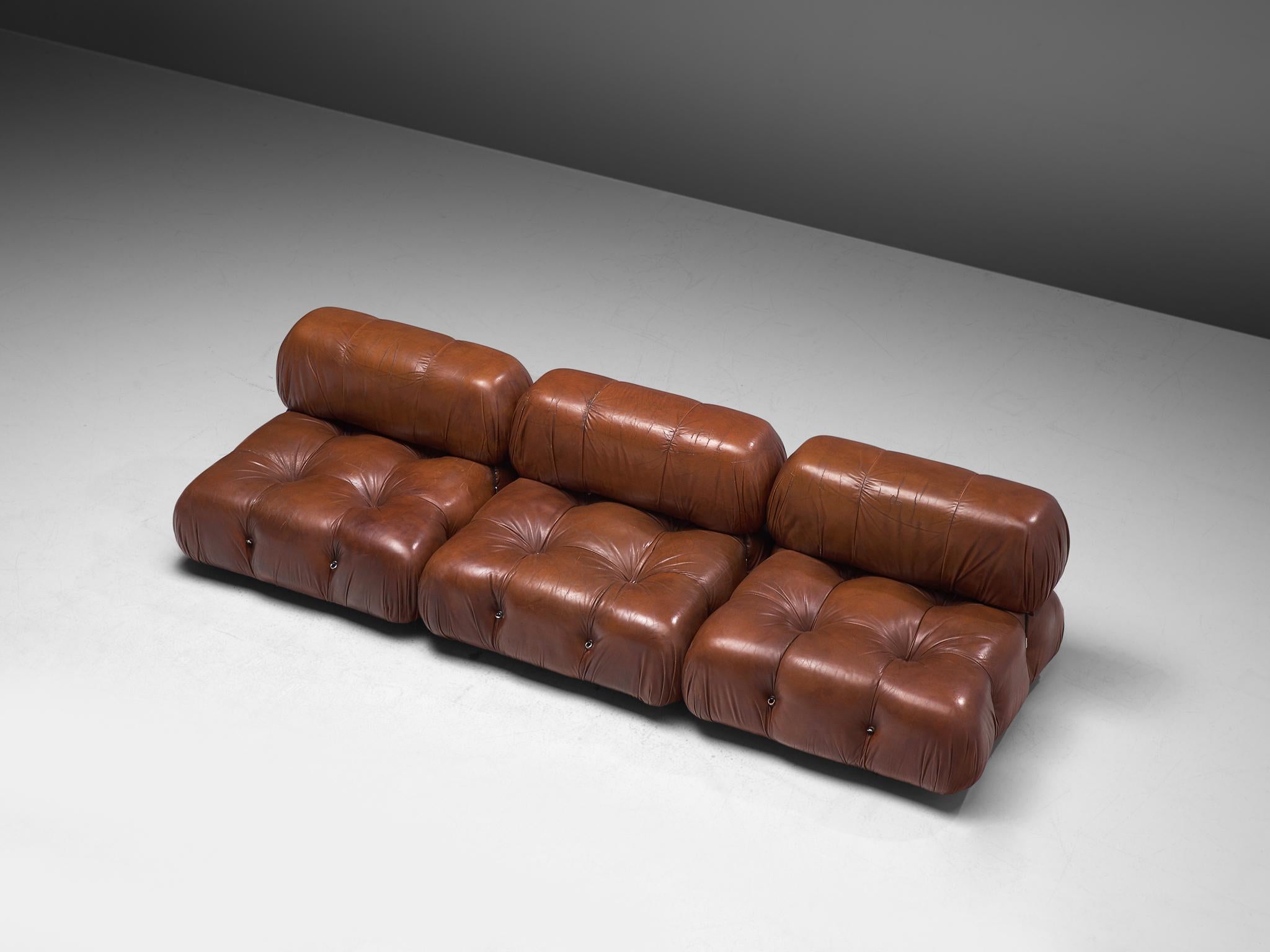 Mario Bellini, modular 'Cameleonda' sofa in original brown leather, Italy, 1972.

The sectional elements of this can be used freely and apart from one another. The backs and armrests are provided with rings and carabiners, which allows the user to