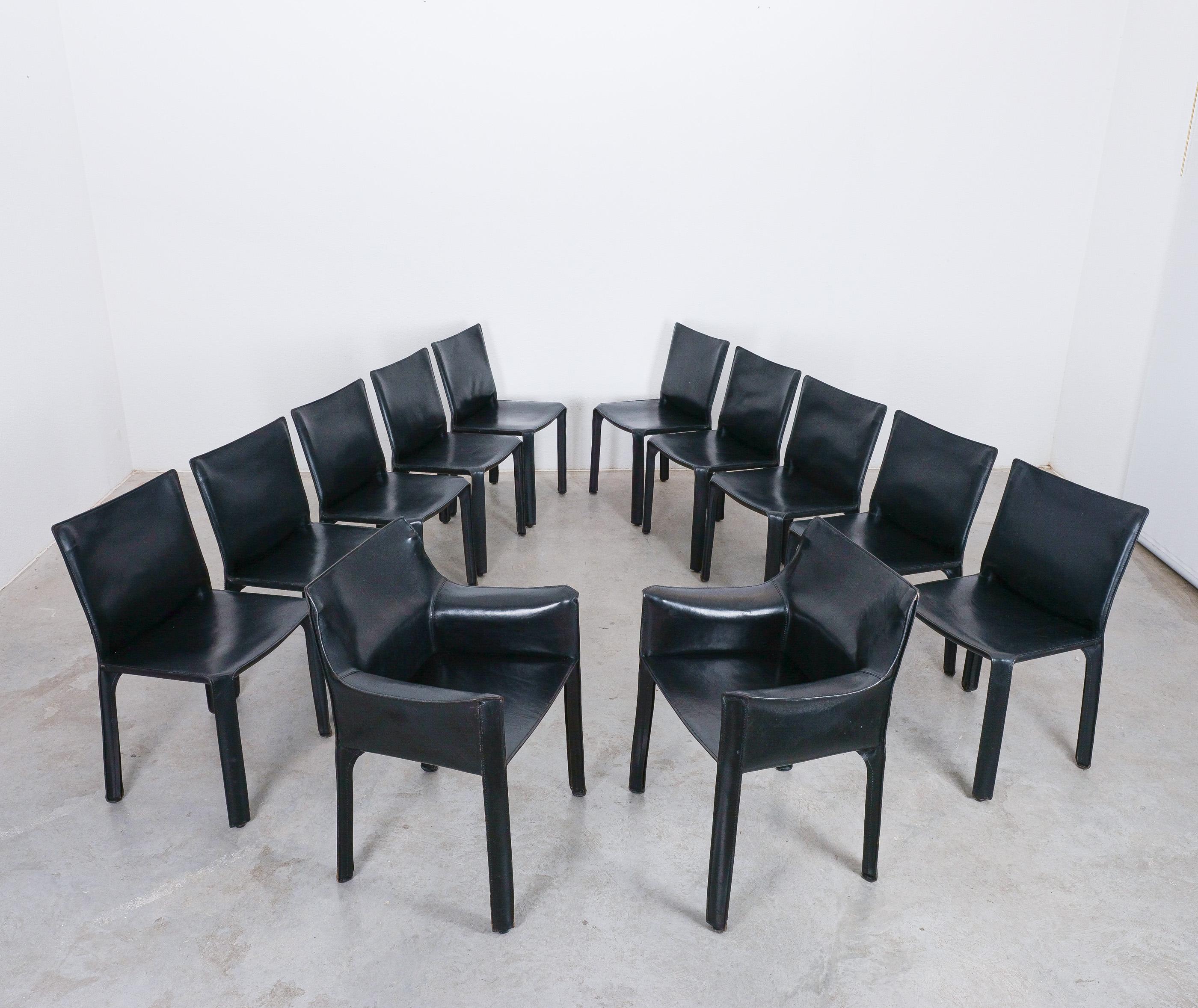 Wonderful set of 12 dining chairs by Mario Bellini 1980's; 
2x cab 413 and 10x cab 412 by Cassina

A set of twelve (12)  Italian design icons in black saddle leather, the CAB 412/413 chair by Mario Bellini for Cassina is up for sale. It consist of a