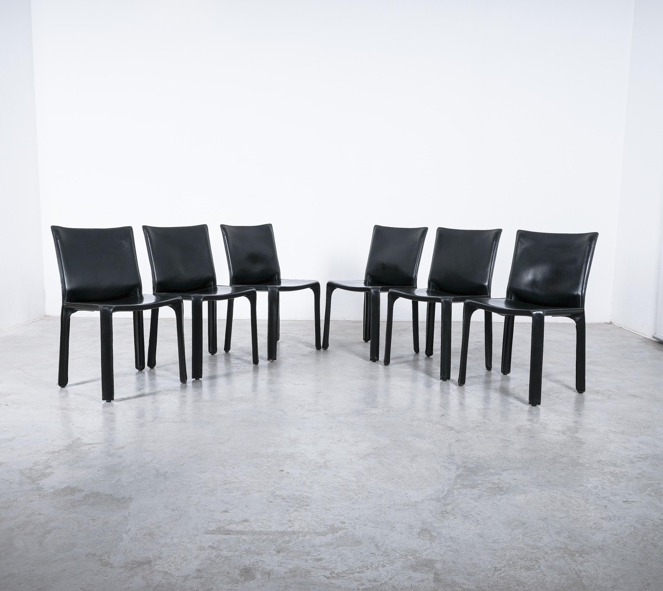 Wonderful set of 8 dining chairs by Mario Bellini 1980's; 2x cab 413 and 6x cab 412 by - They are early versions from the 1980's and in very good condition.

A set of eight Italian design icons in black saddle leather, the CAB 412/413 chair by