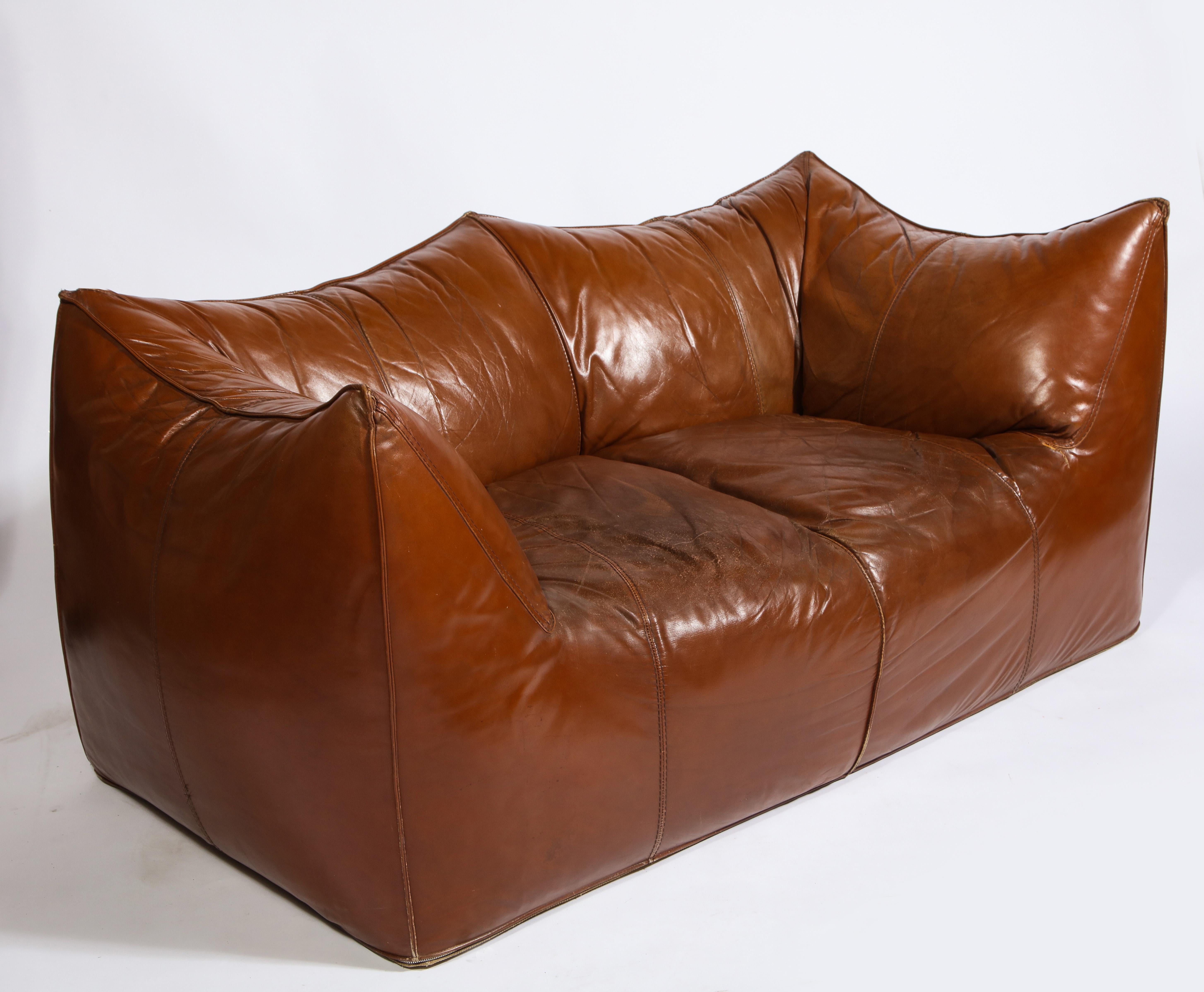 Mario Bellini Cognac brown leather sofa, chair, ottoman Bambole set, Italy. 

Sofa set, beautiful deep cognac color. Beautiful vintage condition, Italy, 1970s.

Measures: Sofa
30 inches high
63 inches wide
31 inches deep
15 inches seat
