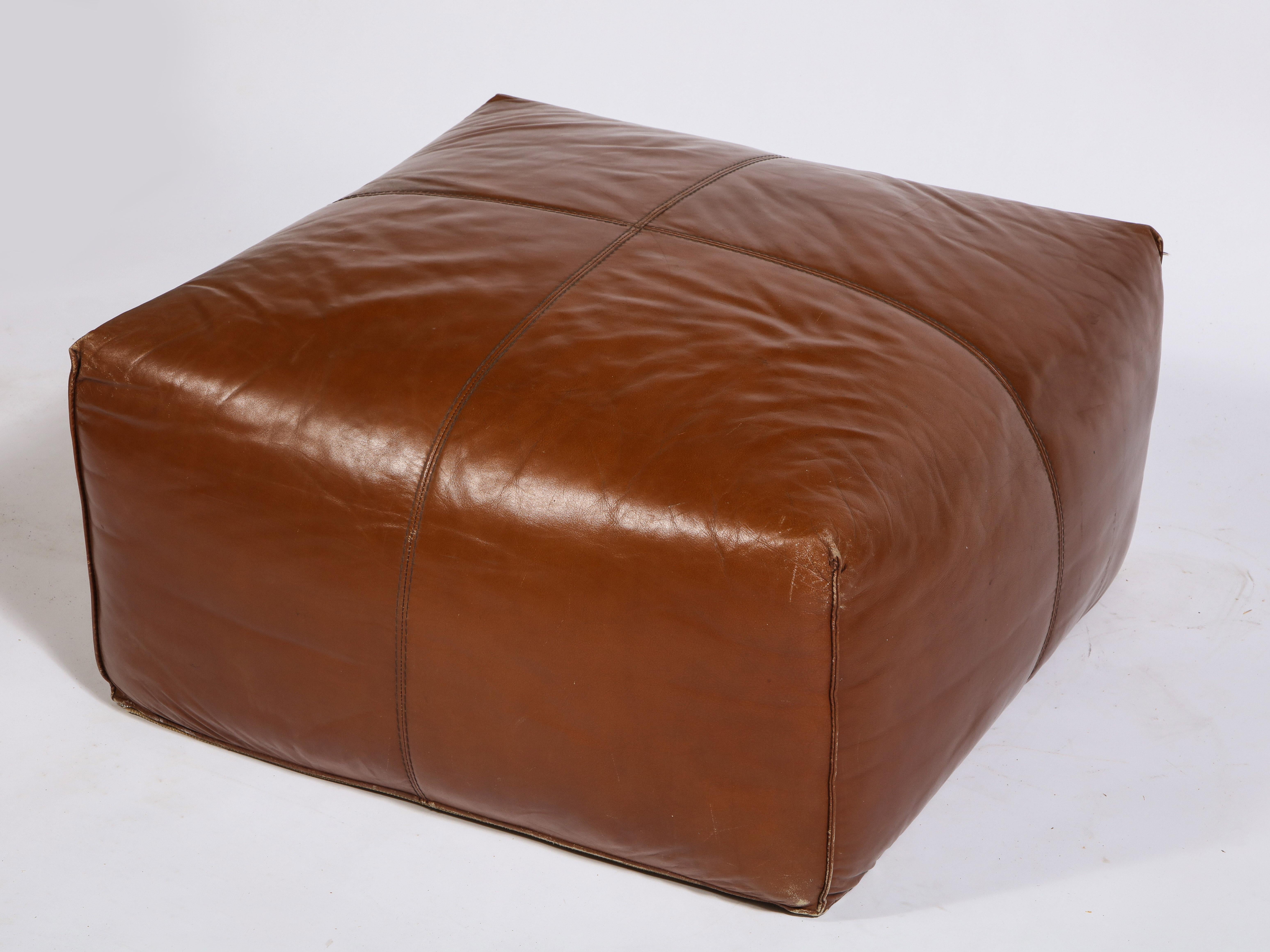 brown leather sofa with ottoman