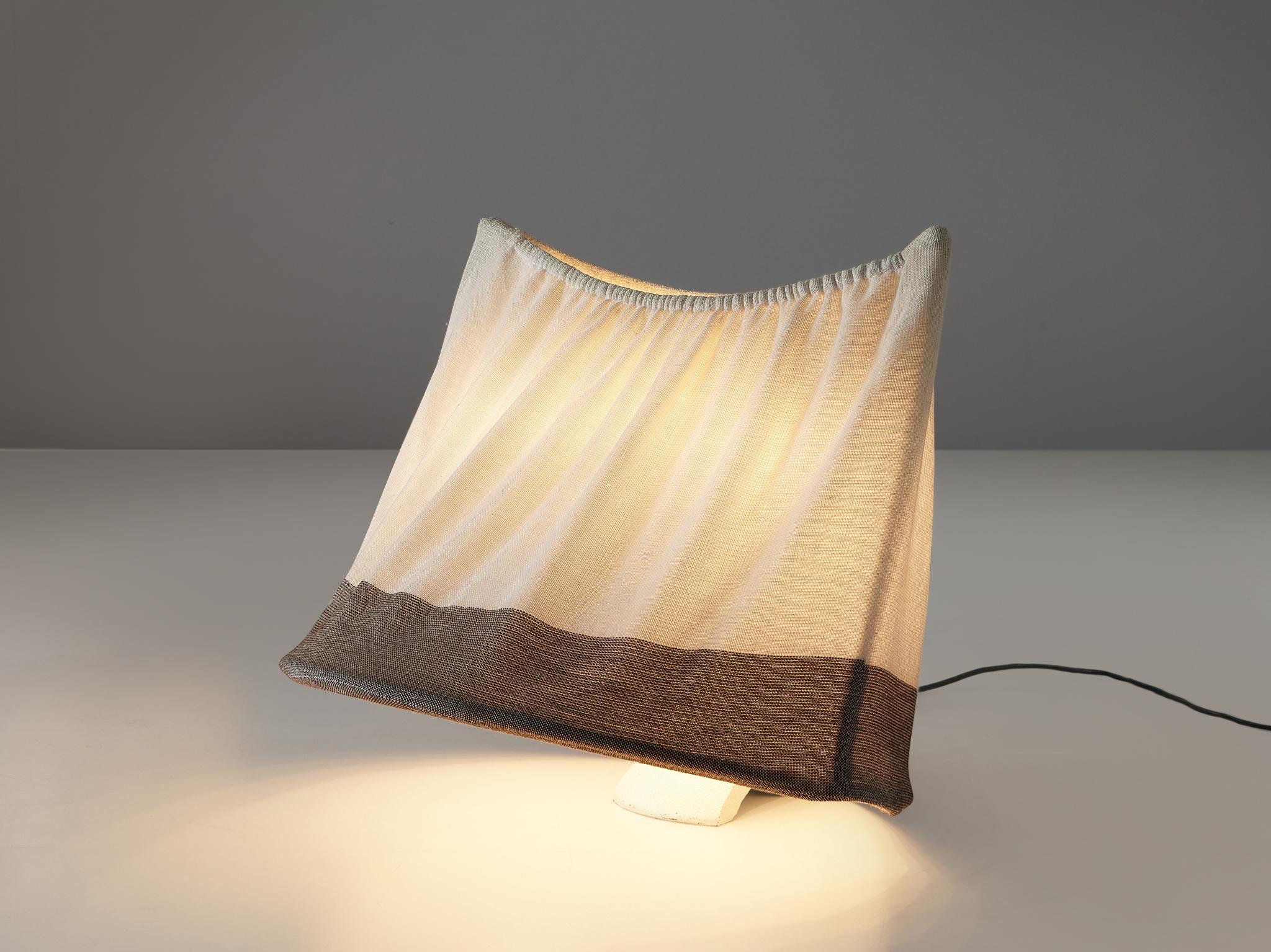 Mario Bellini for Artemide, table lamp, lacquered metal, fabric, Italy, 1978. 

Quirky and quite unique, this 'circo' table lamp designed by Mario Bellini, is a true example of Bellini's original approach towards furniture design. The shade, which