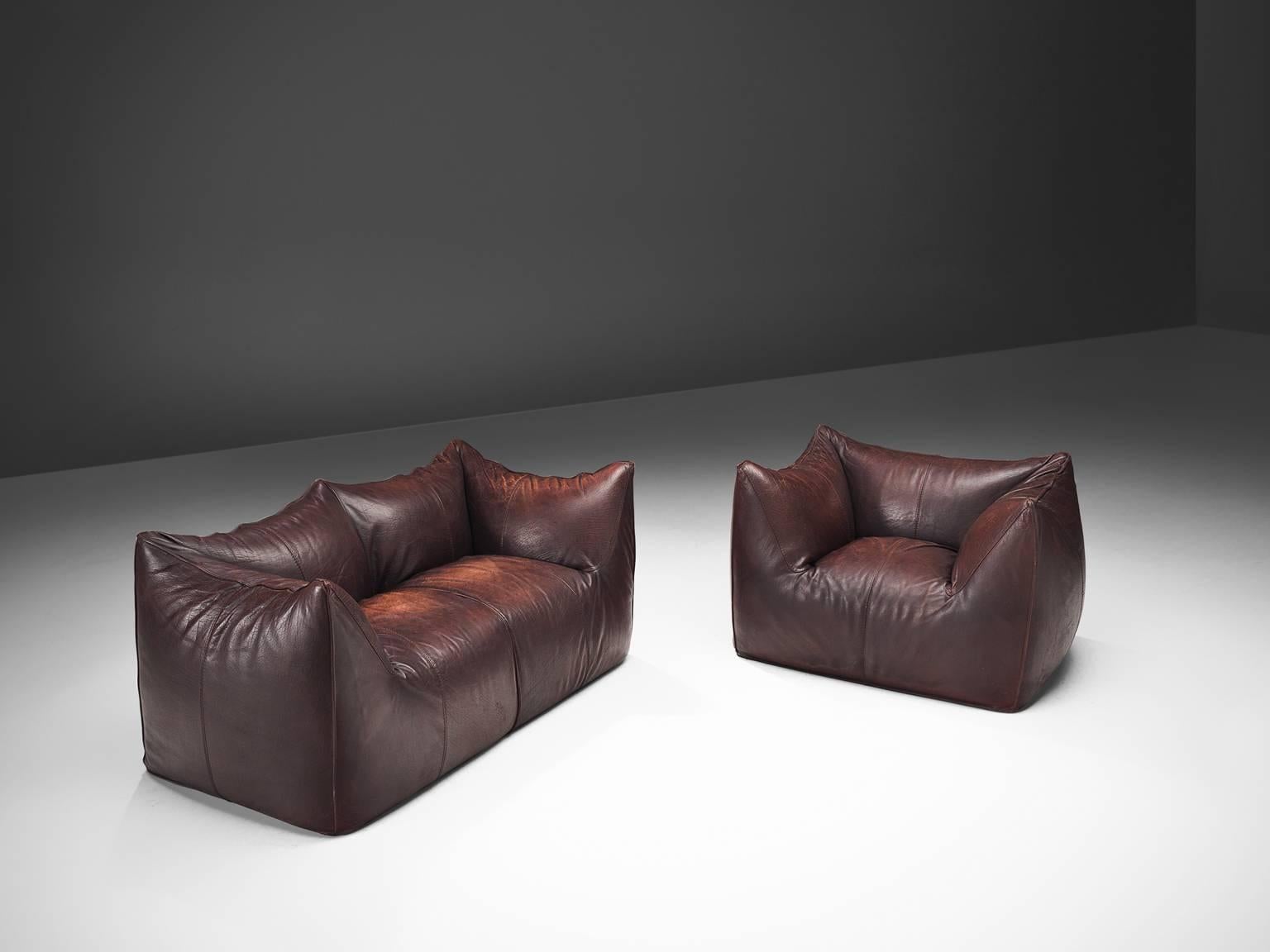 Mario Bellini for B&B Italia, 'Le Bambole' living room set, brown leather, Italy, 1972. 

This comfortable dark brown set is bulky and playful, shaped as if it is merely a large cushion and the accompanying feeling is the same. It is designed by