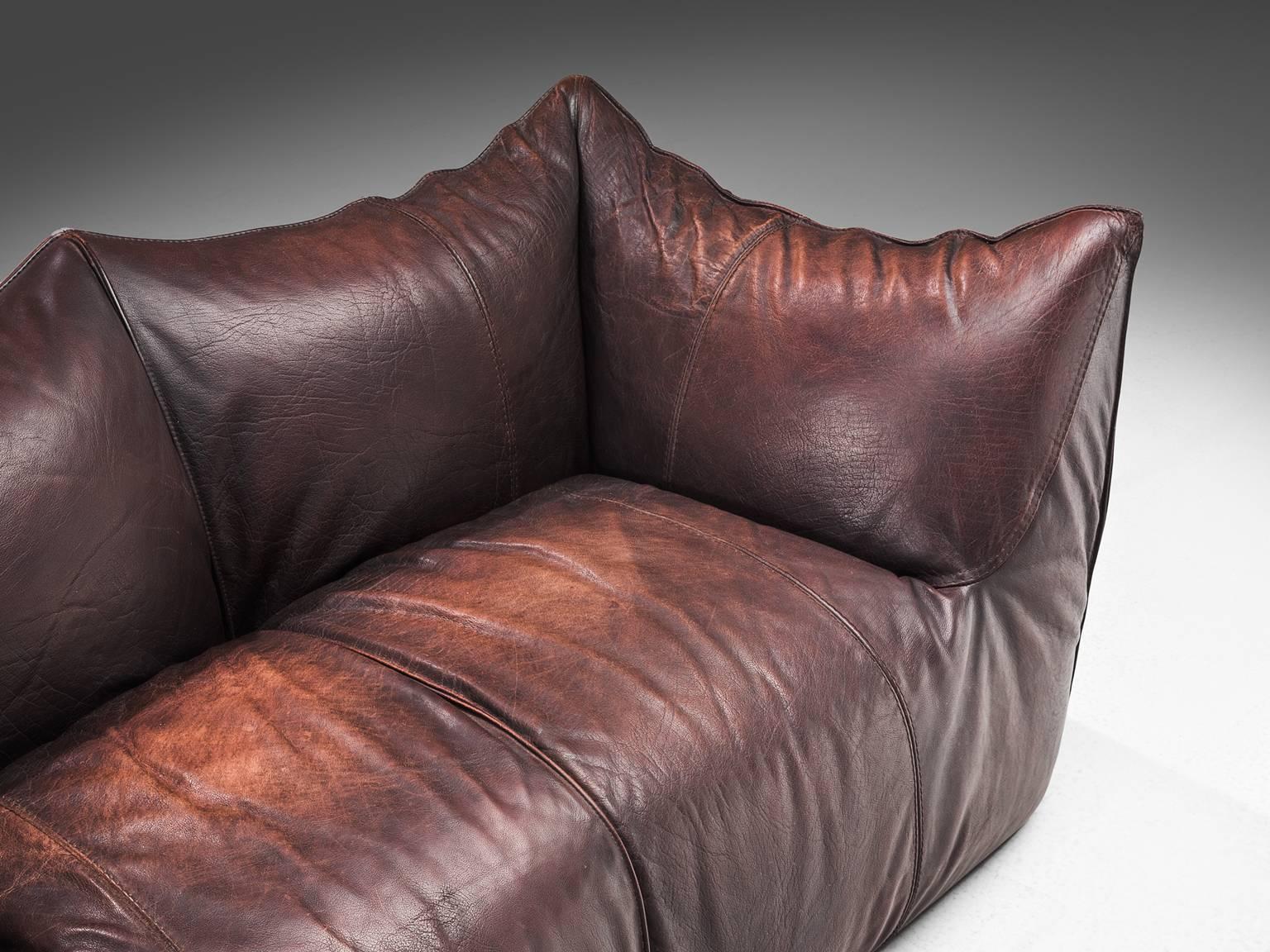 Mario Bellini for B&B Italia, 'Le Bambole' sofa, brown leather, Italy, 1972.

This comfortable dark brown settee is bulky and playful, shaped as if it is merely a large cushion and the accompanying feeling is the same. It is designed by Mario