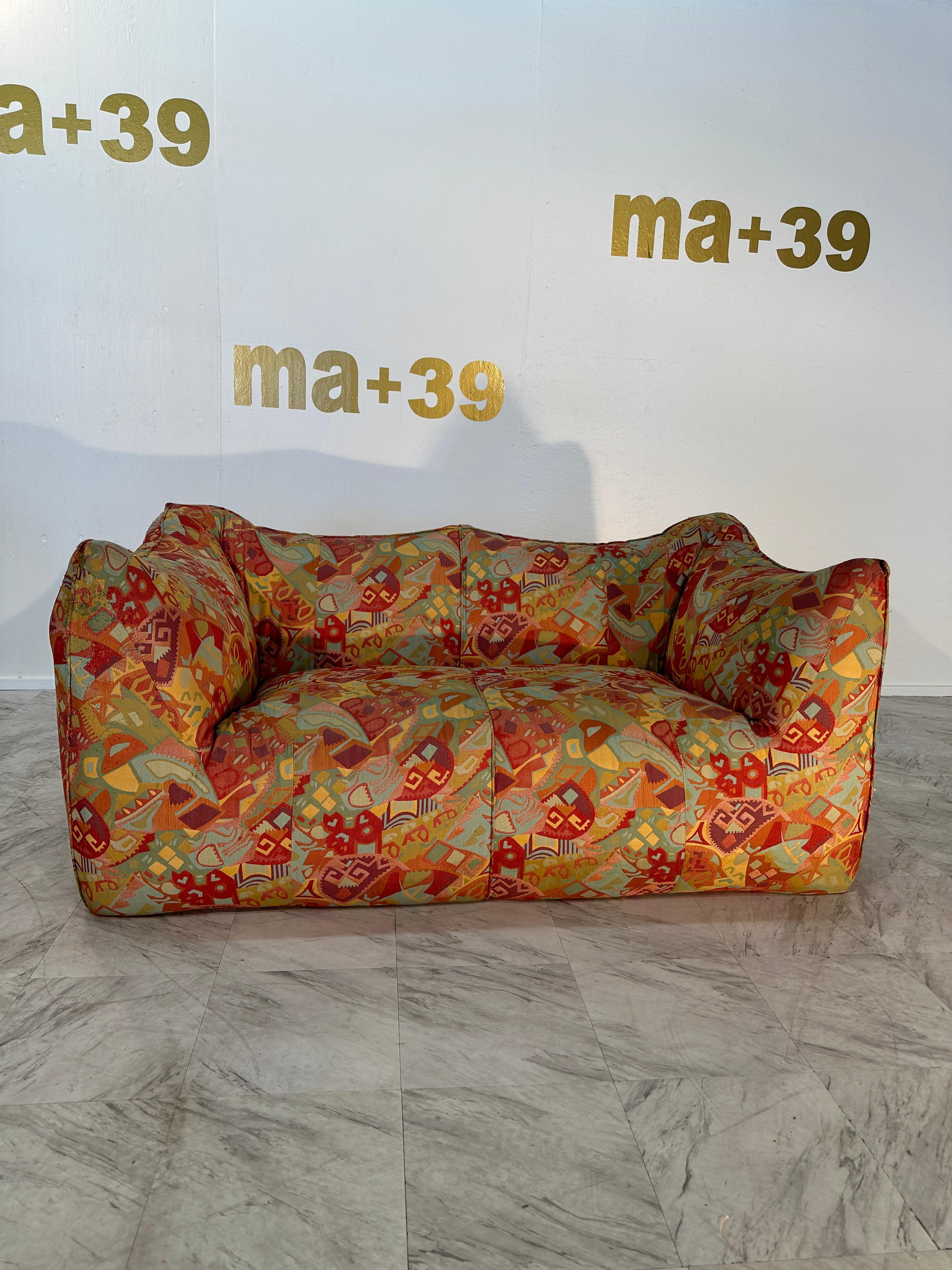 This comfortable Flowers fabric settee is bulky and playful, shaped as if it is merely a large cushion and the accompanying feeling is the same. It is designed by Mario Bellini and was the culmination of research into stuffed furniture. In the
