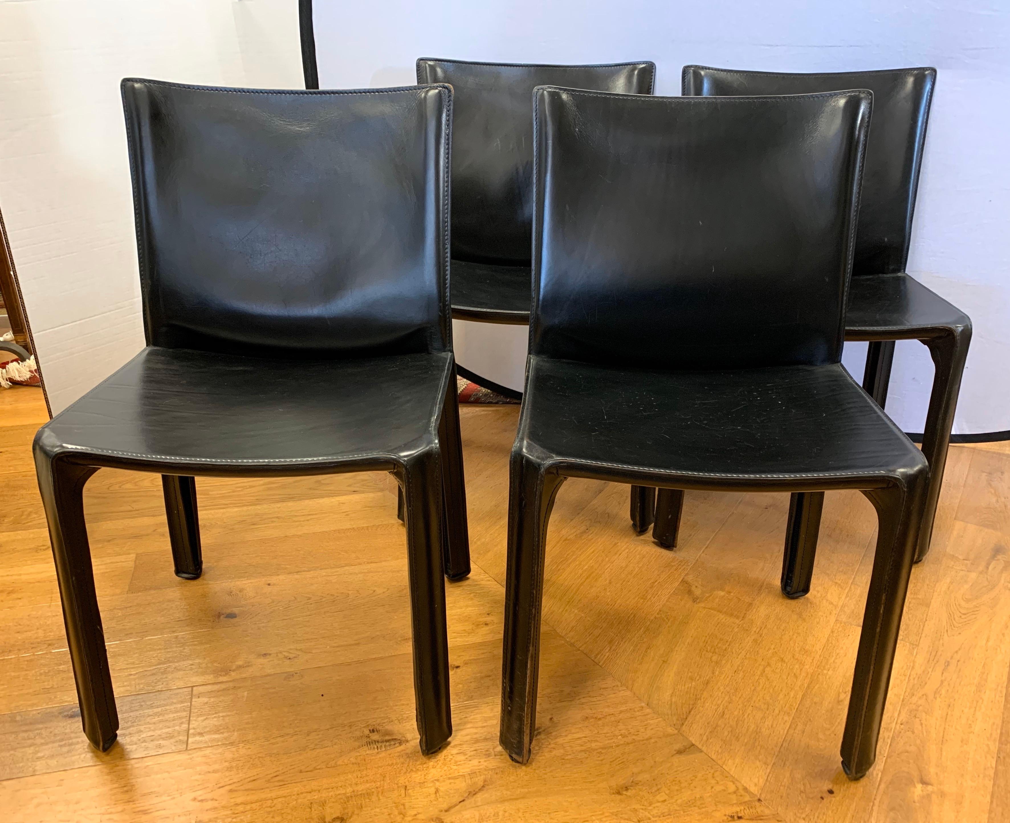 Iconic, signed Cassina Mario Bellini black leather side chair; four available and priced per chair. These feature the famed zipper up the legs.