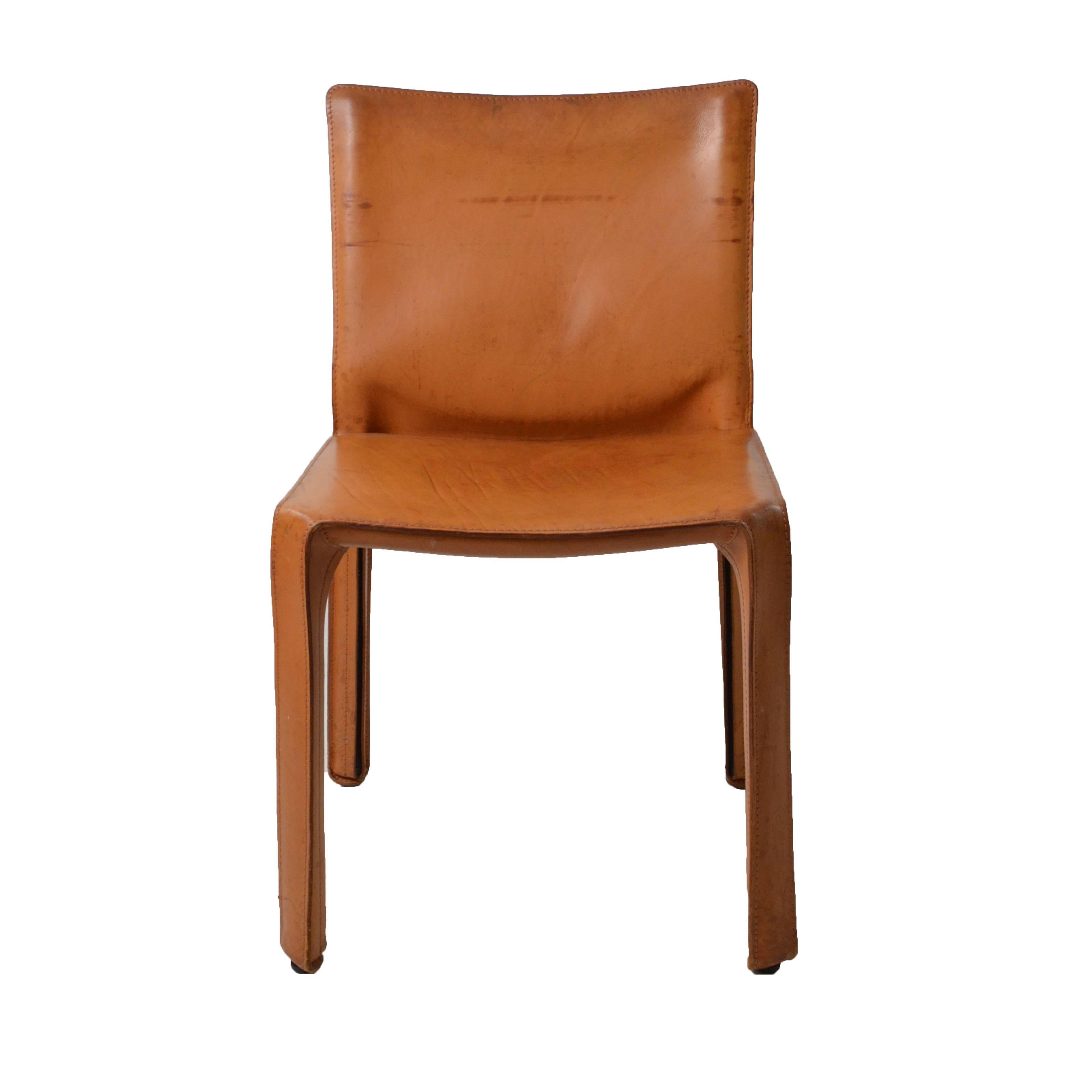 Eight original Cab chairs model. 412, marked Cassina constructed totally out of leather. Good conditions, minor signs coherent with age and prior use, original patina. A video is available upon request to enjoy the piece as you are in front of