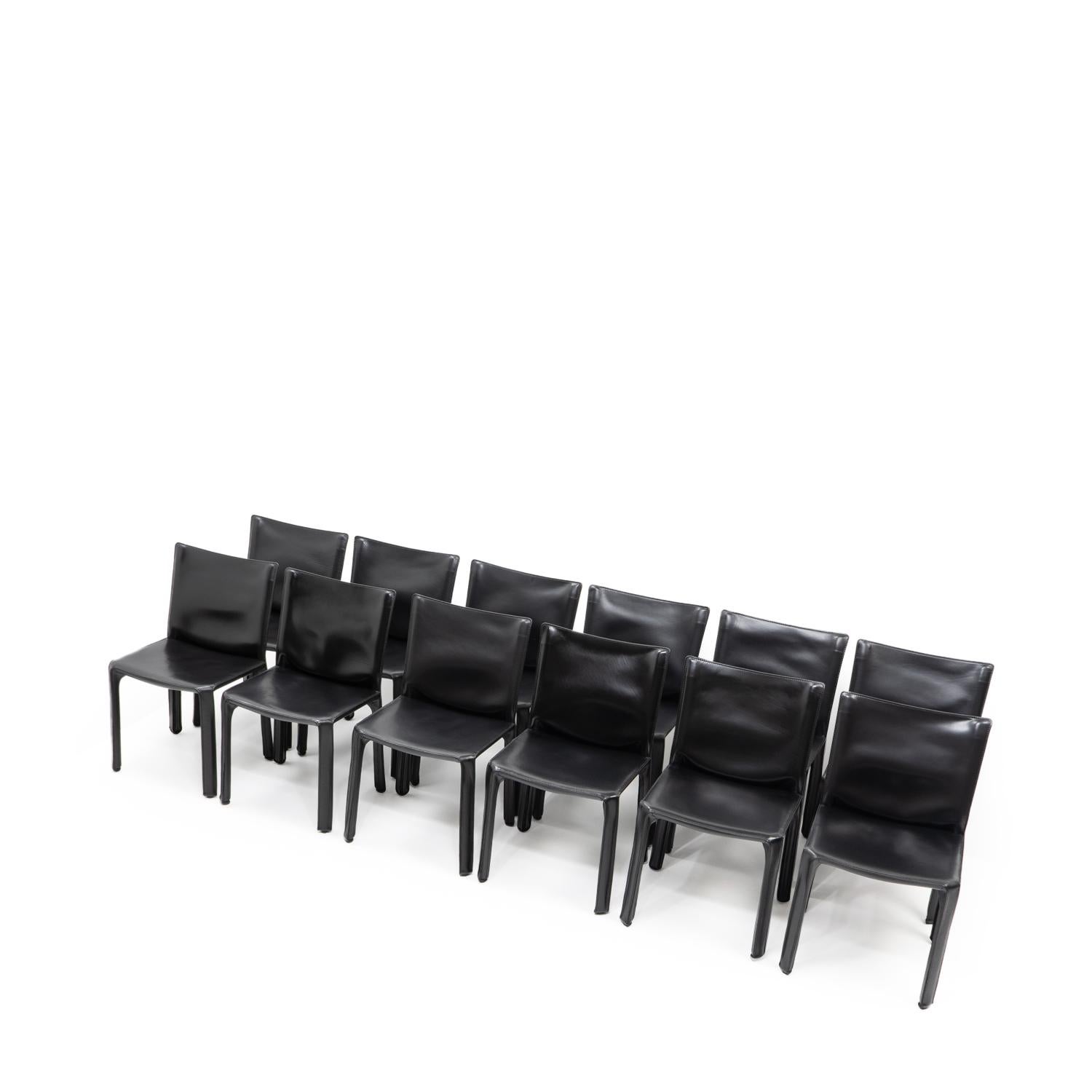 Set of 12 Cab 412 side chairs in black leather by Mario Bellini for Cassina.

The Cab chair is built up as a tubular frame over which thick saddle leather is fitted; the leather skin is kept in place with zippers on the inside legs.

A wonderful