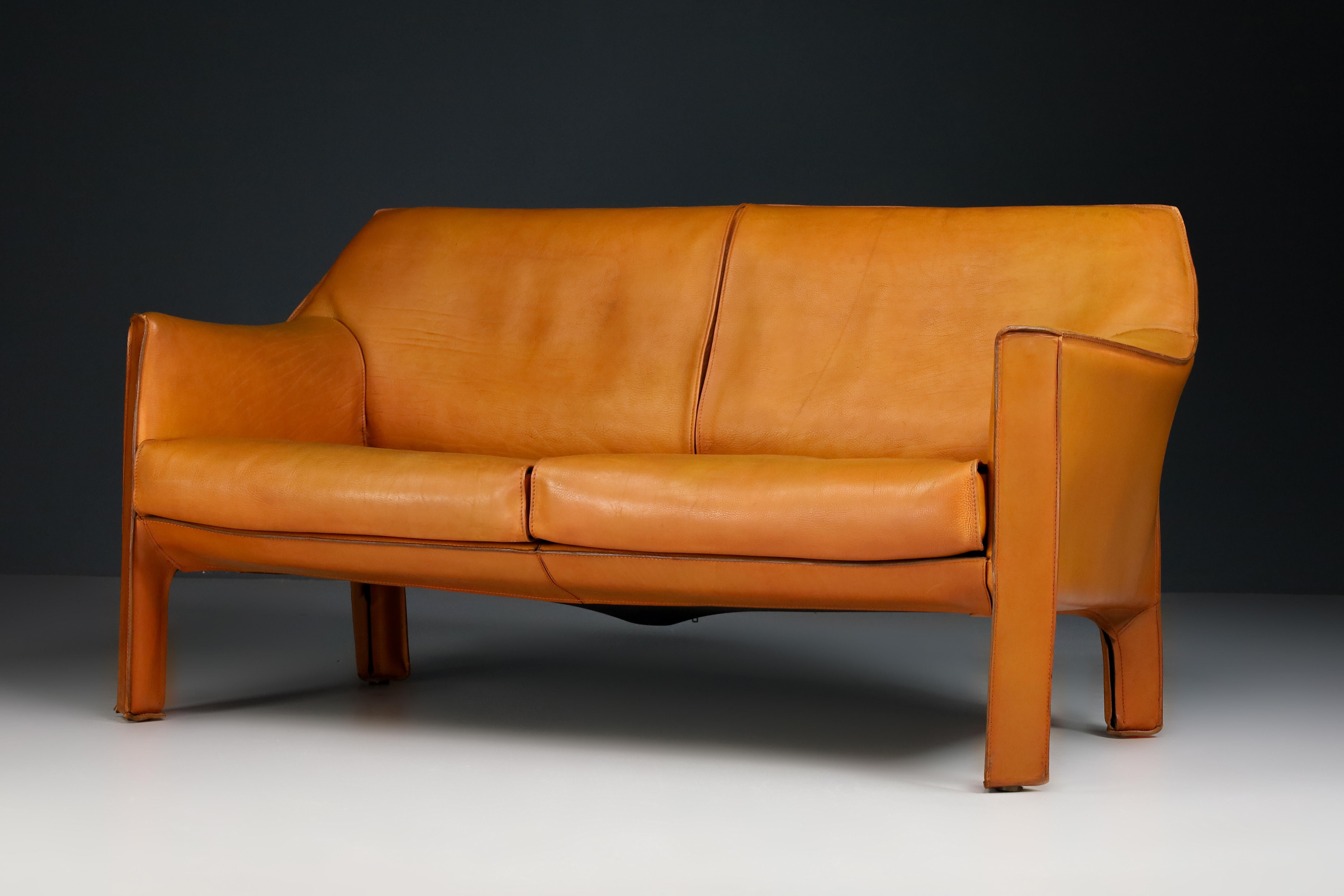 A beautiful rare out-of-production Mario Bellini Model 415 'Cab' two seat sofa in incredible thick Patinated Buffalo Cognac leather, by Cassina (signed), designed in the 1970s, this early production examples produced in circa 1980s. This fine
