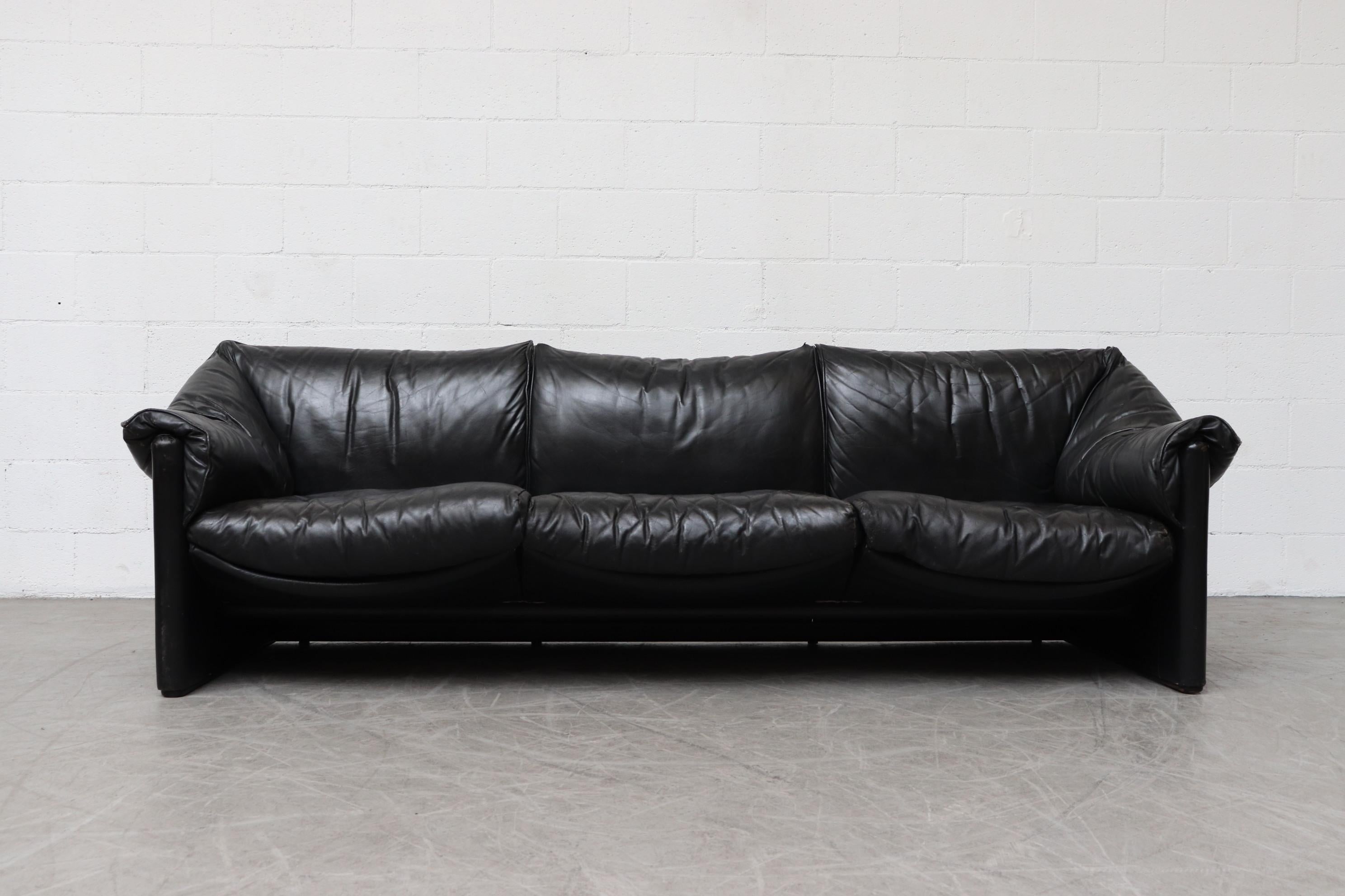 Handsome black leather 3-seat sofa designed by Mario Bellini for Cassina. Well worn with nice heavy patina. In original condition with visible signs of wear.